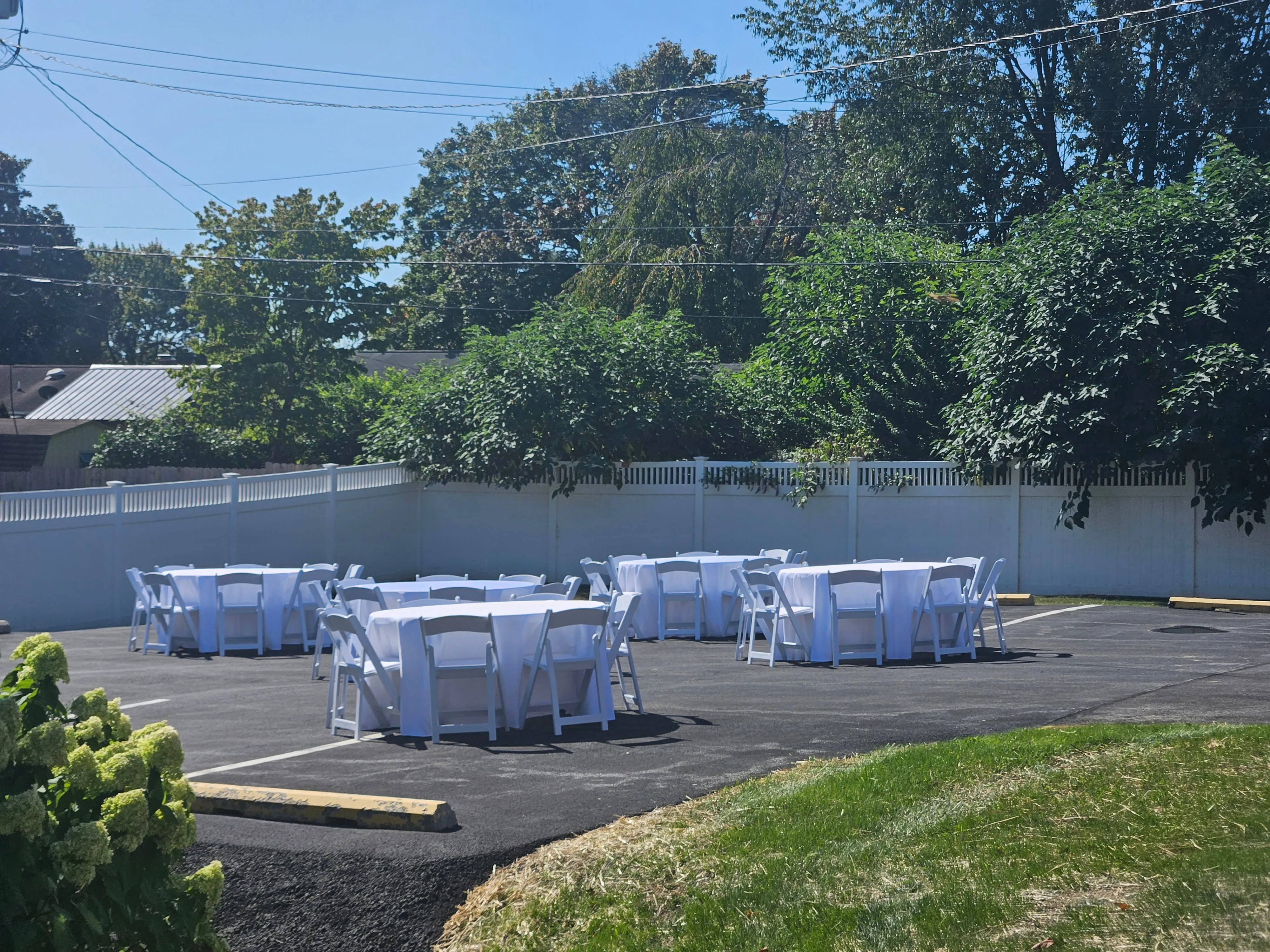 Professional corporate event setup with rental tables and chairs