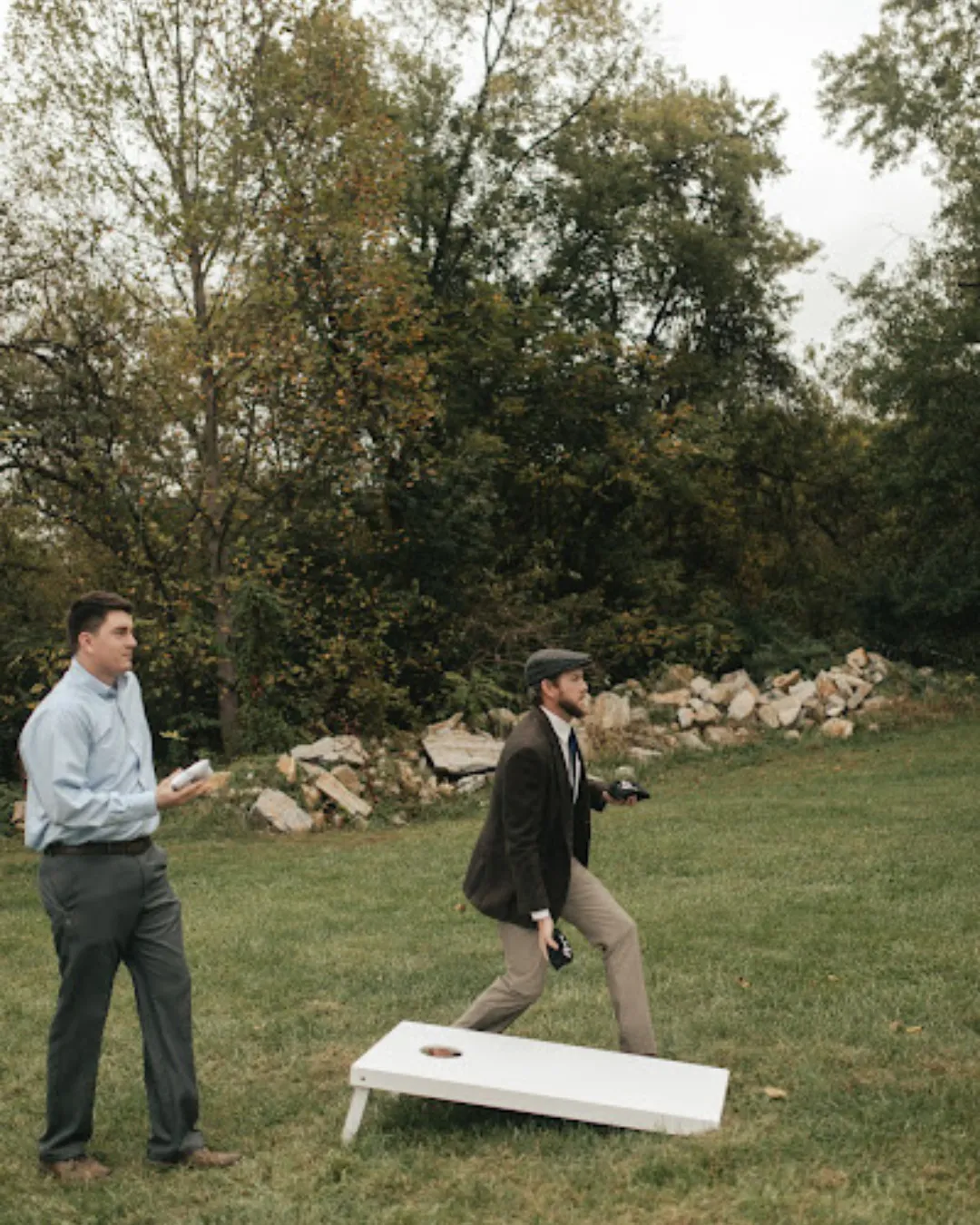 Backyard party rental setup with yard games