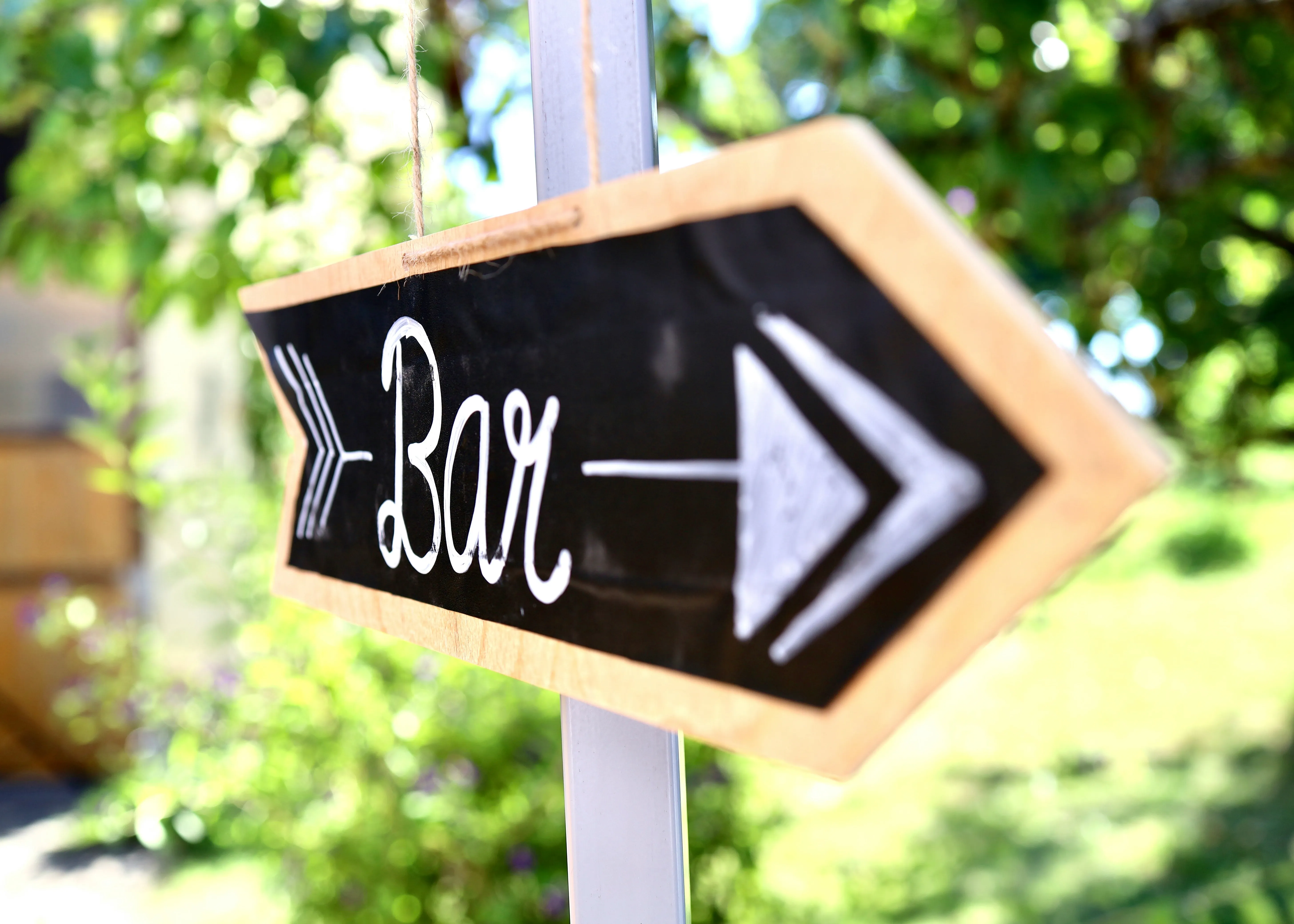 Wedding sign pointing to the bar for alcoholic drinks in Maine