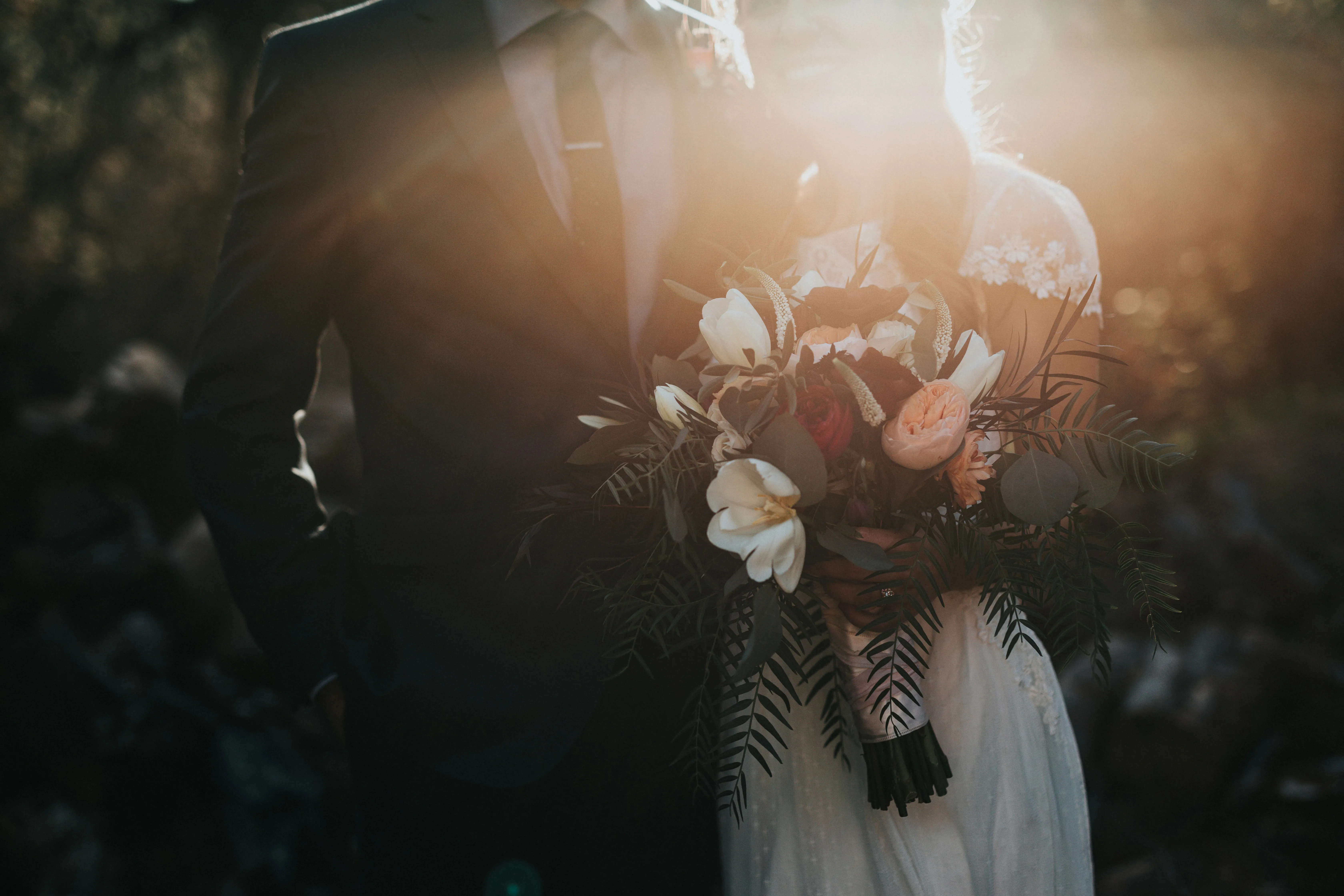 Bride and groom holding flowers