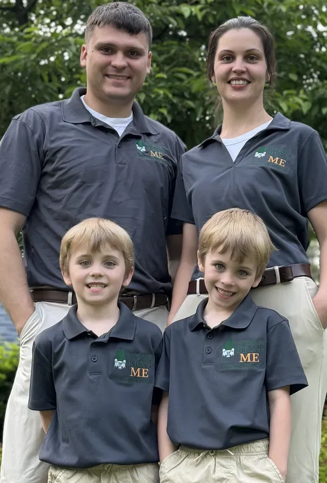 Becca standing with her husband and twin boys, wearing Event Rent ME logo polo shirts and khaki pants