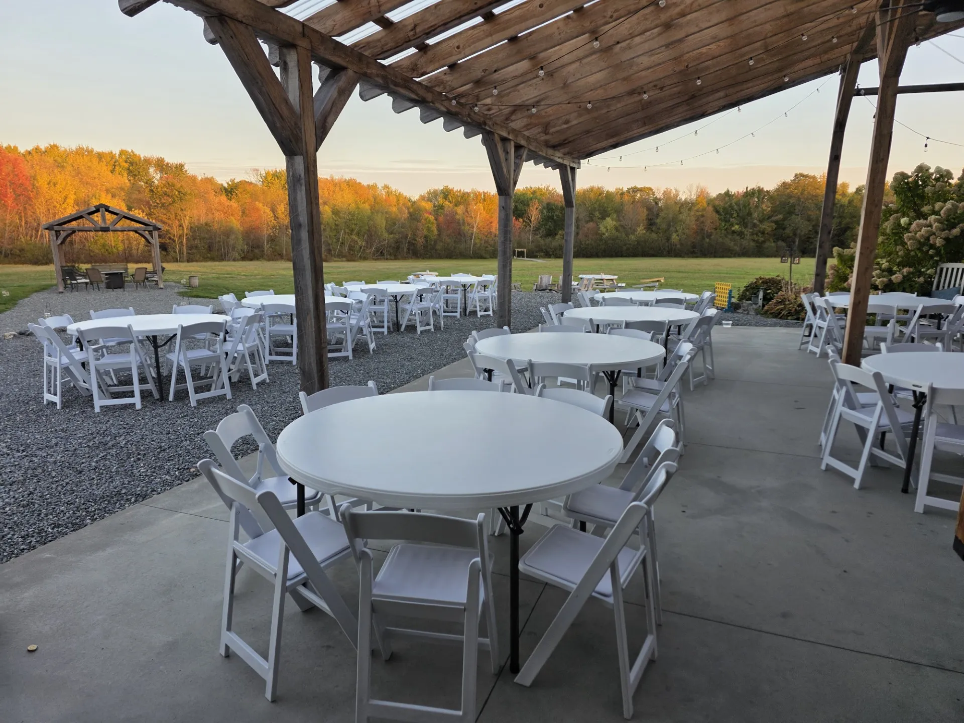 Wedding under a pergola with a beautiful farmland in the background