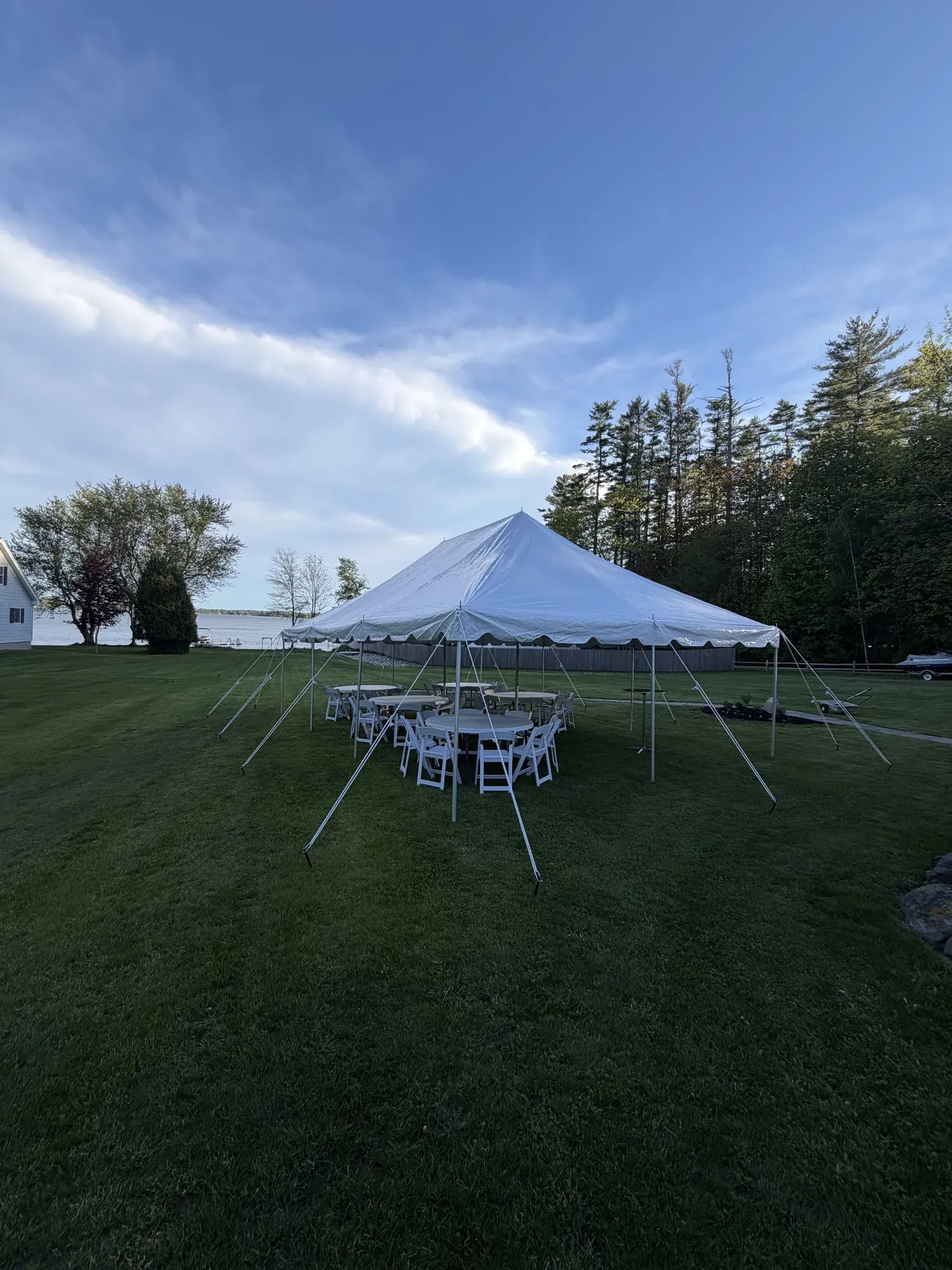 20x30 pole tent setup for a wedding on the lake