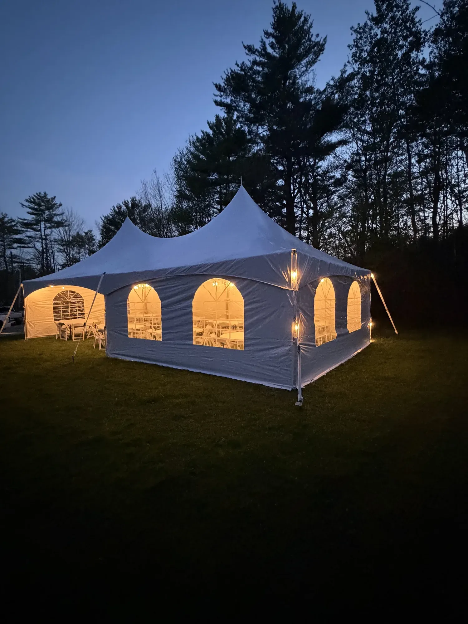 20x40 high peak frame tent with sidewalls and lighting setup for a wedding