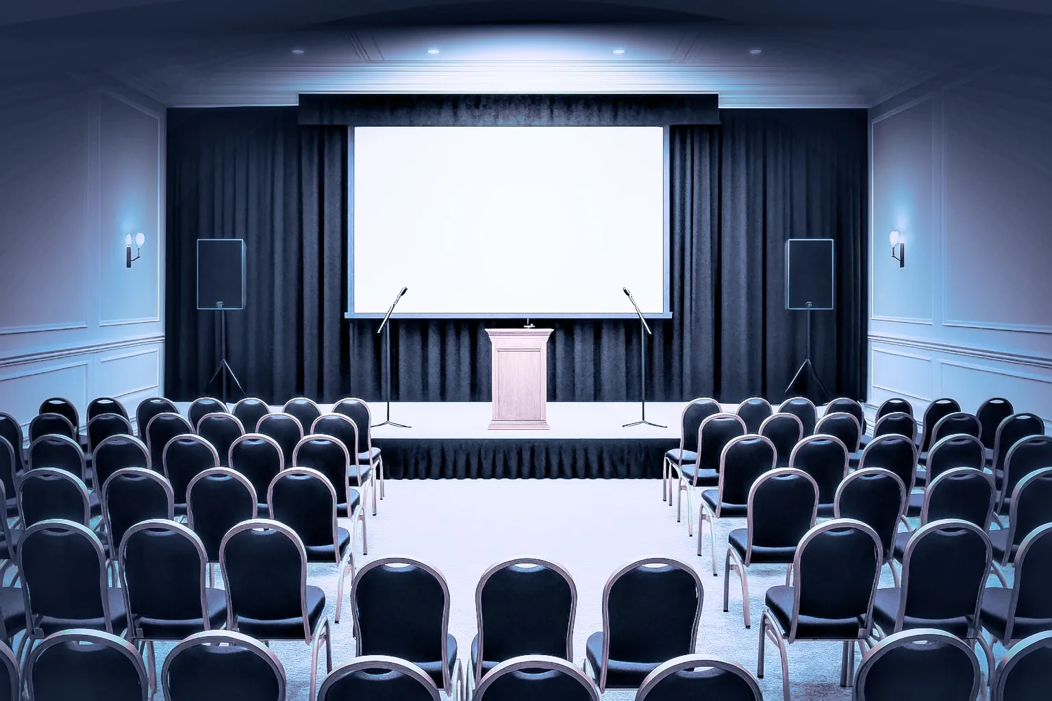 Conference and corporate event setup featuring professional audio, video, and presentation equipment in a business meeting environment.