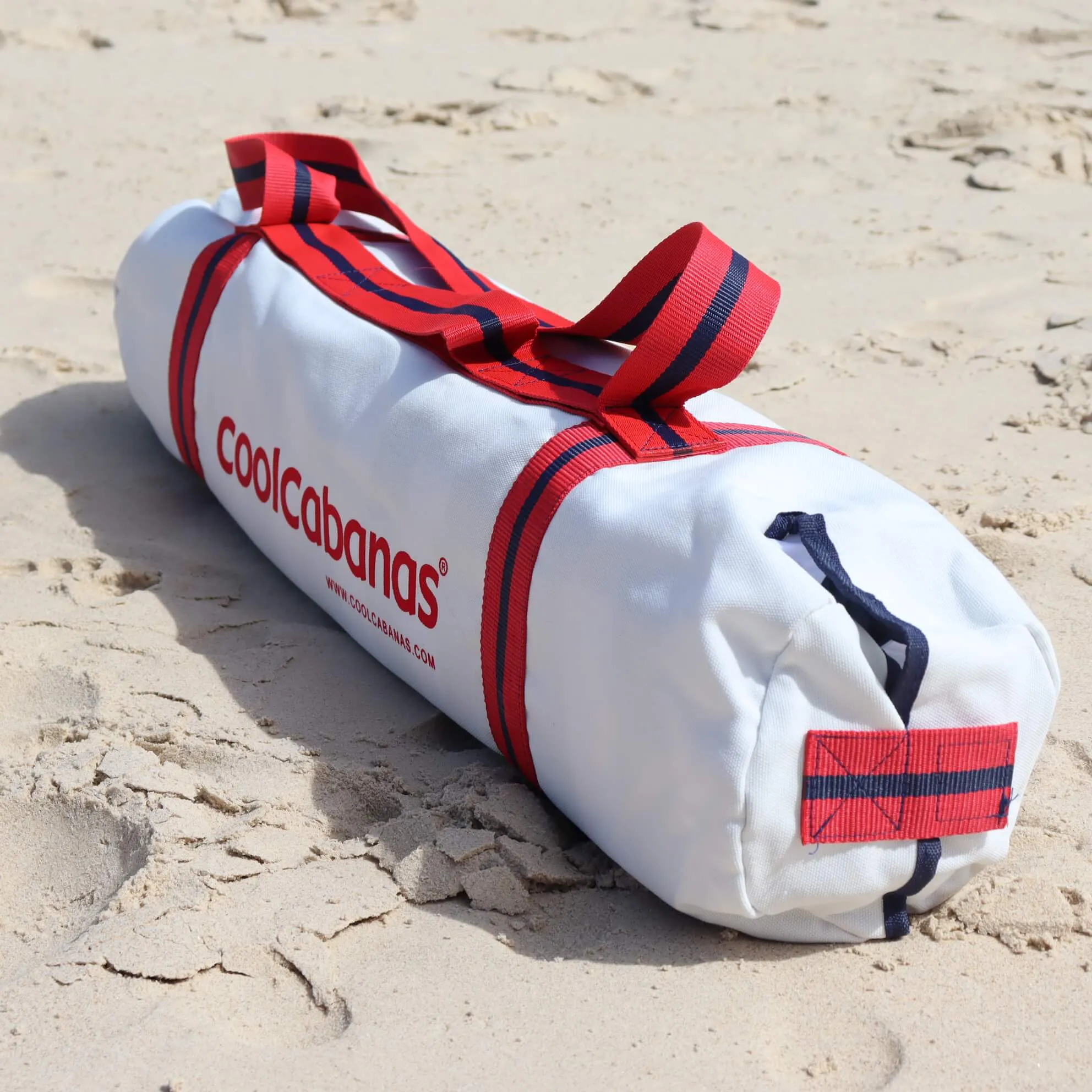 White and red CoolCabana packed in carry bag on Coolangatta beach, Queensland.