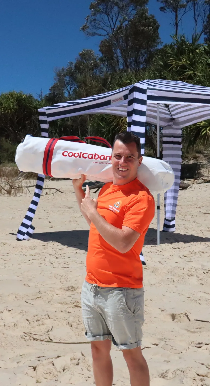 Rental CoolCabana set up on a windy New South Wales beach, providing shade on the sand.
