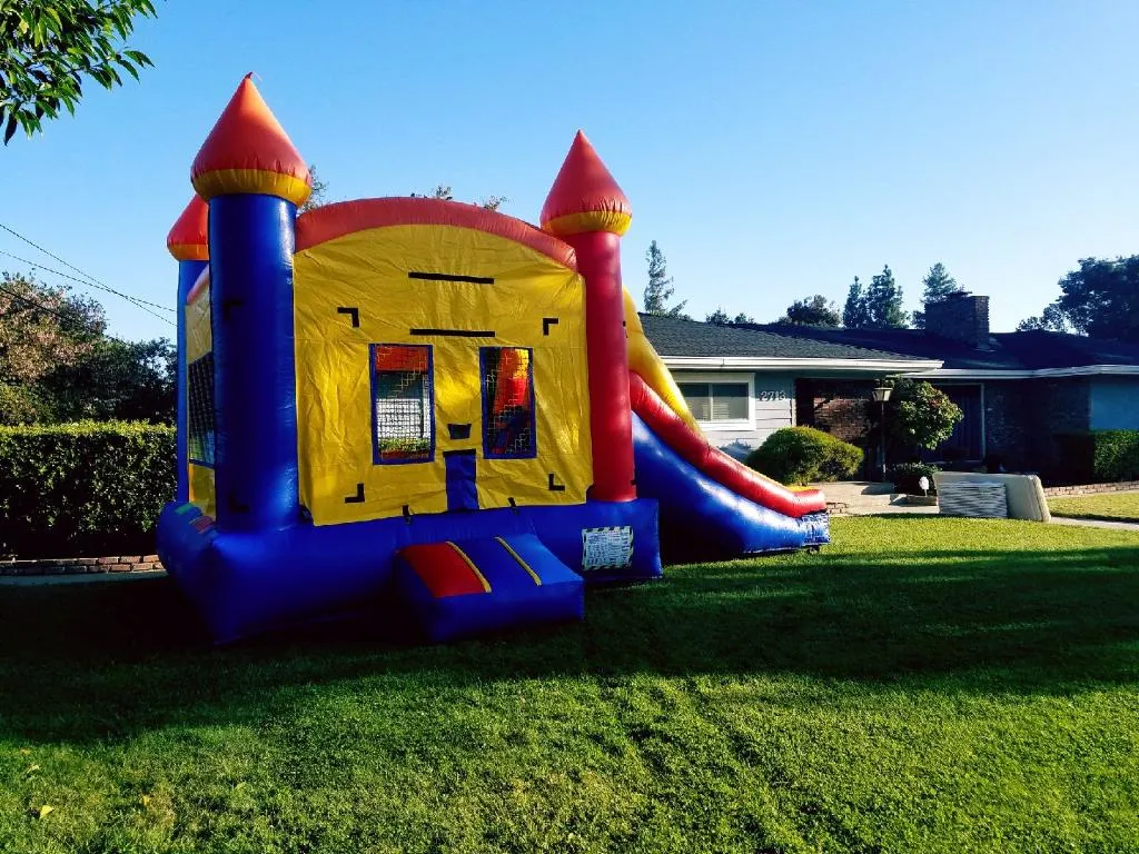 Commercial inflatable water slide rentals, themed jumpers, and bounce house combo units by Marti Event Rentals in Modesto, CA. Heavy-duty obstacle courses, dry slides, and backyard water slip n slides for summer birthday parties and family events throughout Turlock, Ceres, Salida, and the Central Valley.