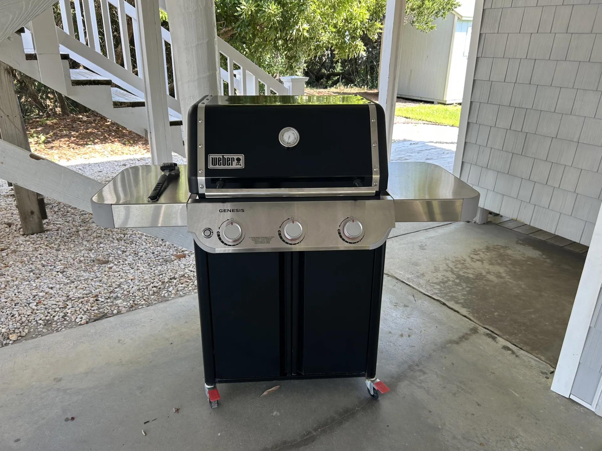 Weber 3 burner grill in driveway