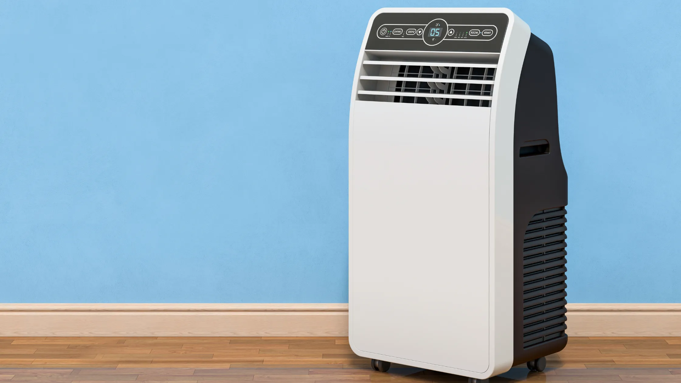 A portable air conditioning unit in a room with a blue wall and wood flooring.