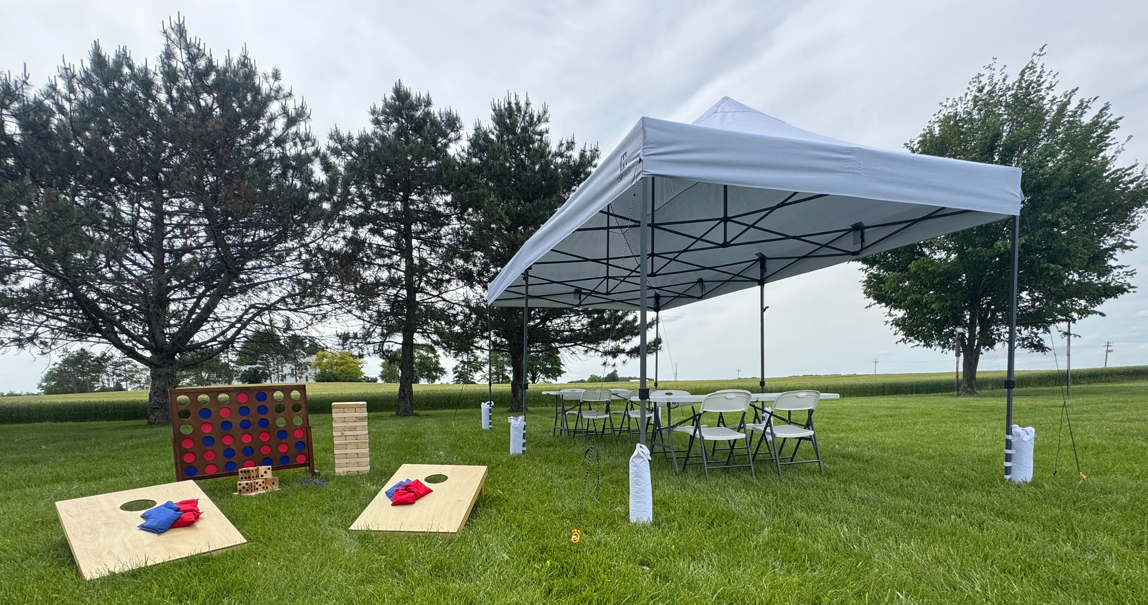 White tables, chairs, event tents, corn hole, giant yard games Northwest Ohio