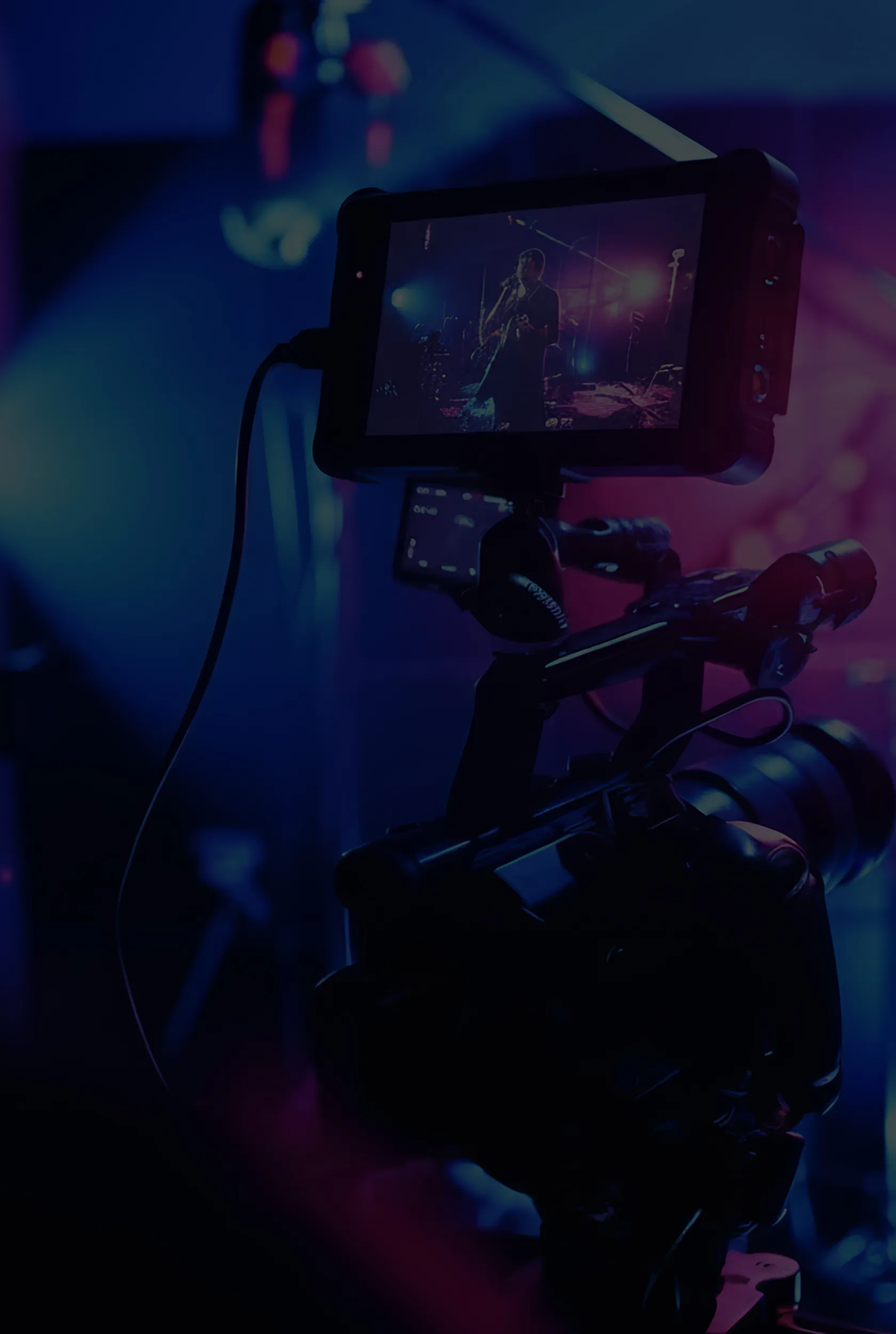 A Niagara videographer using camera equipment on a film set