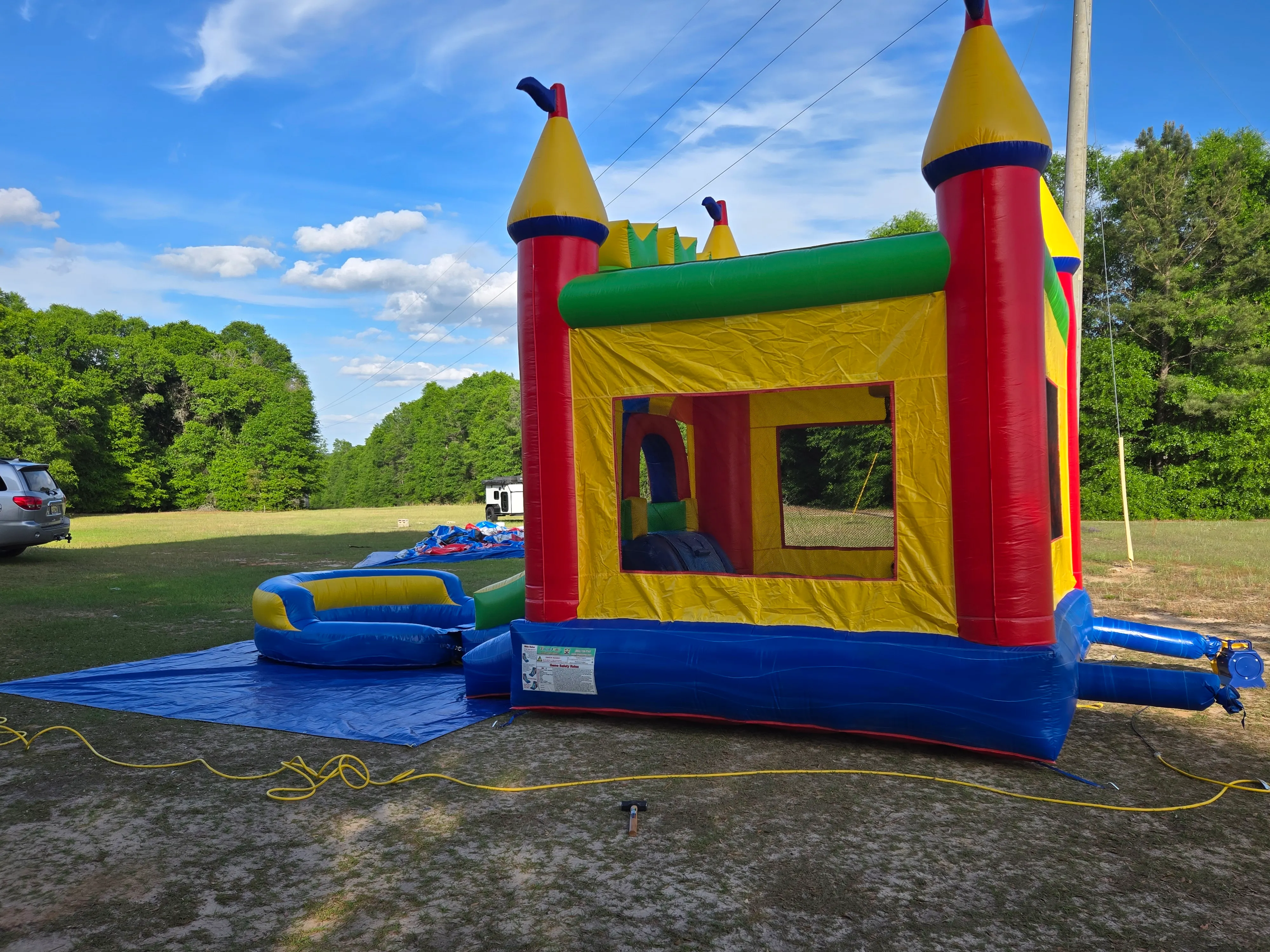 Bounce house with pool and slide