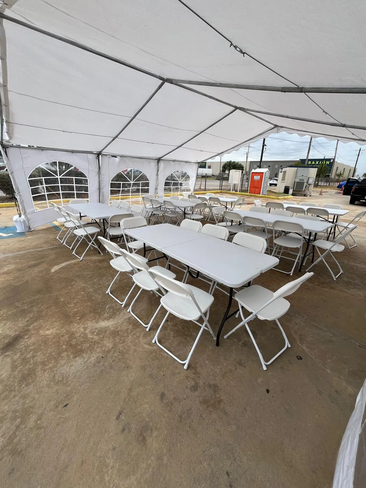 anquet table rentals for a backyard party under a tent in Laredo, TX.