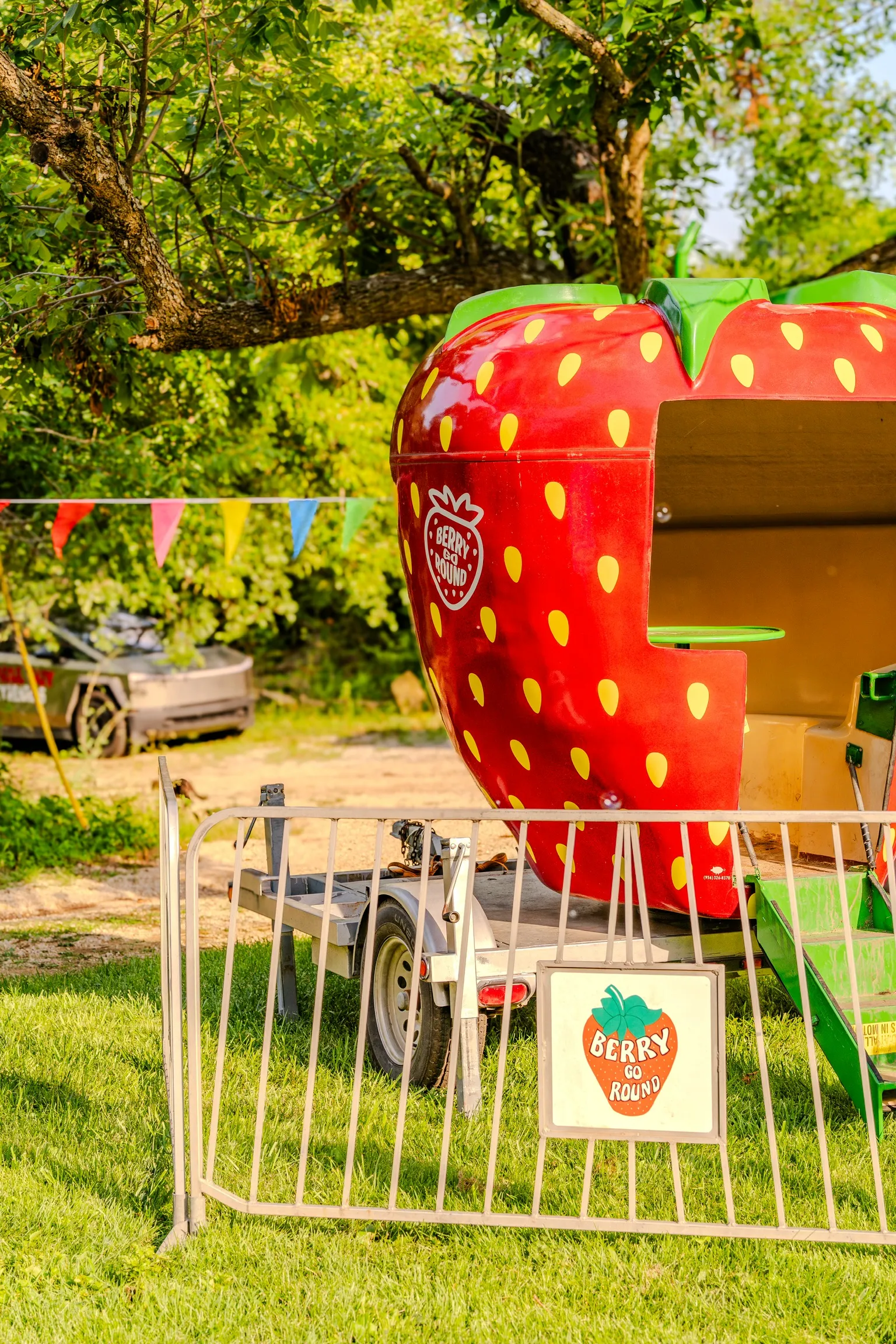 Large community festival in Emporia, Kansas featuring event tents, carnival rides, inflatable attractions, tables, chairs, and families enjoying a Carnival Guy event.
