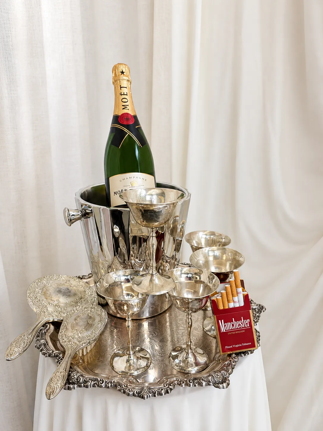 Vintage editorial tablescape with silverware, wine, cigarette styling and layered drapery by Miss Events Melbourne