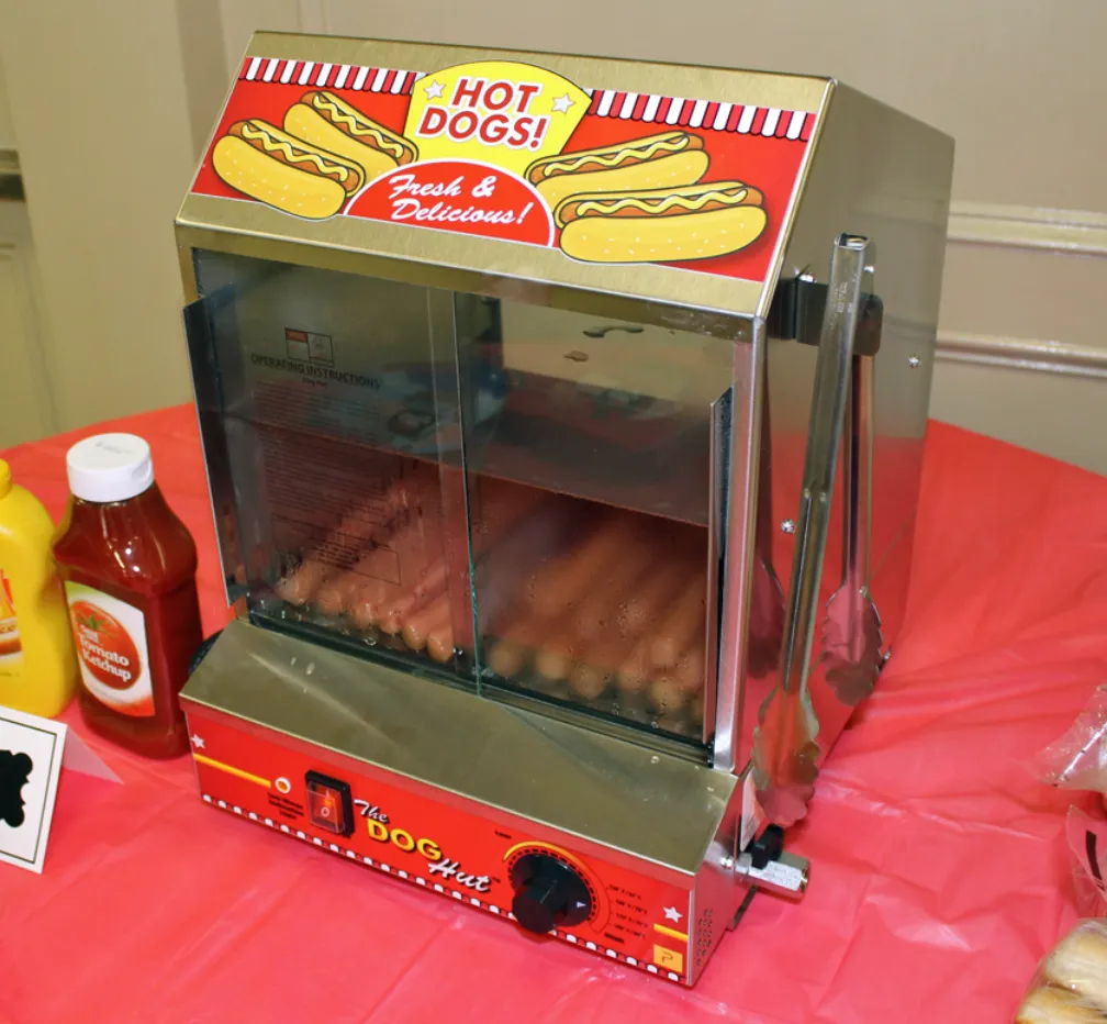 Serve up savory fun with Carnival Guy's hot dog warmer machine rental in Topeka. Keep your hot dogs warm and ready to devour - perfect for parties, events, and festivals. Book now!