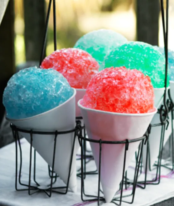 Beat the heat with Carnival Guy's snow cone machine rental in Topeka. Refresh and rejuvenate with our colorful, icy treats - perfect for summer parties, festivals, and events. Book now!