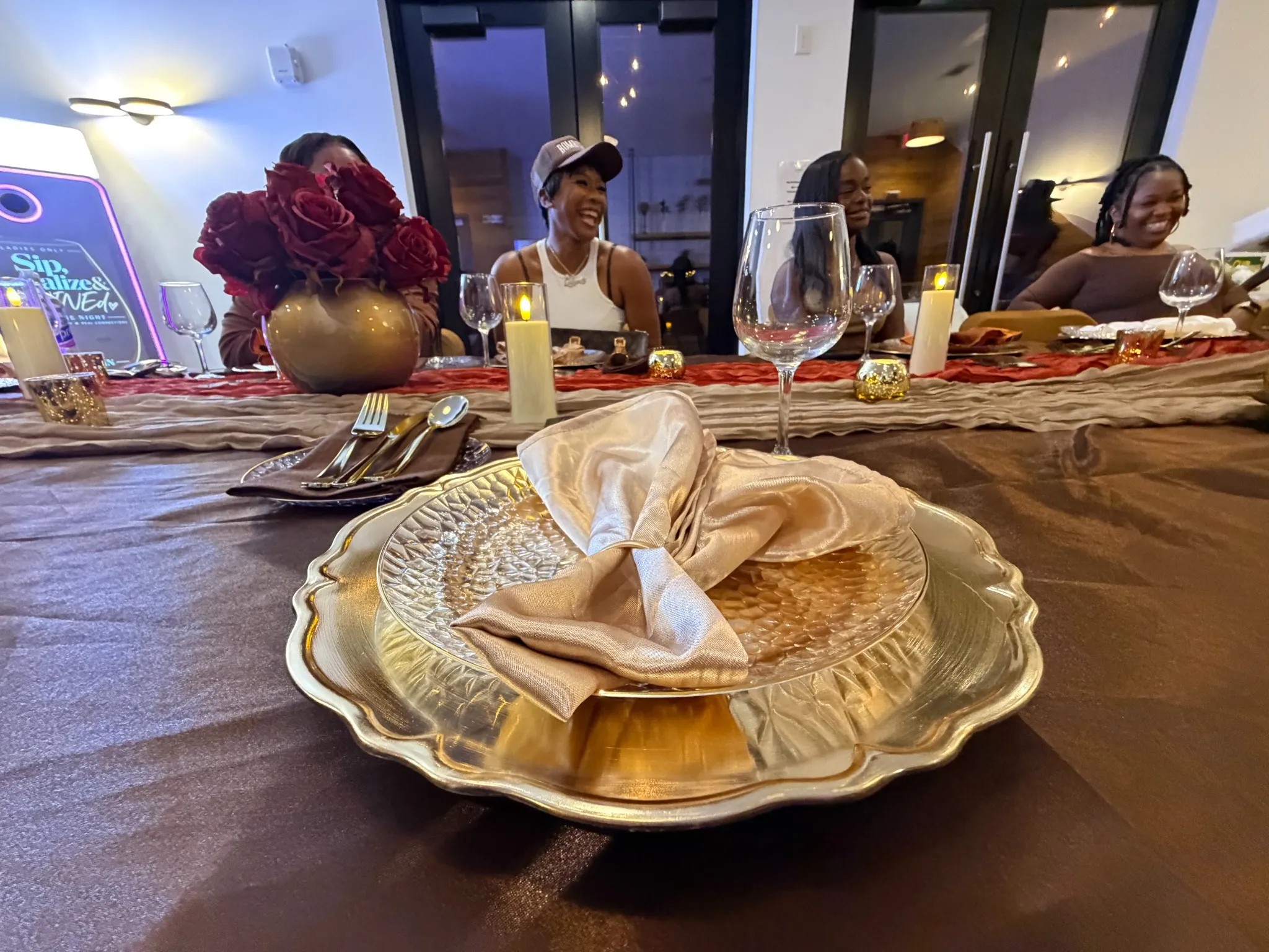 Elegant Brown Butter Moments tablescape with gold place settings for a Metro Atlanta celebration