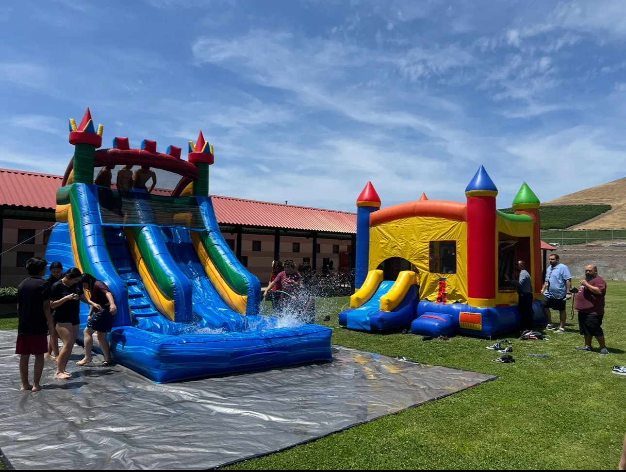 Richie’s Rentals waterslide and bounce house set up at a real celebration