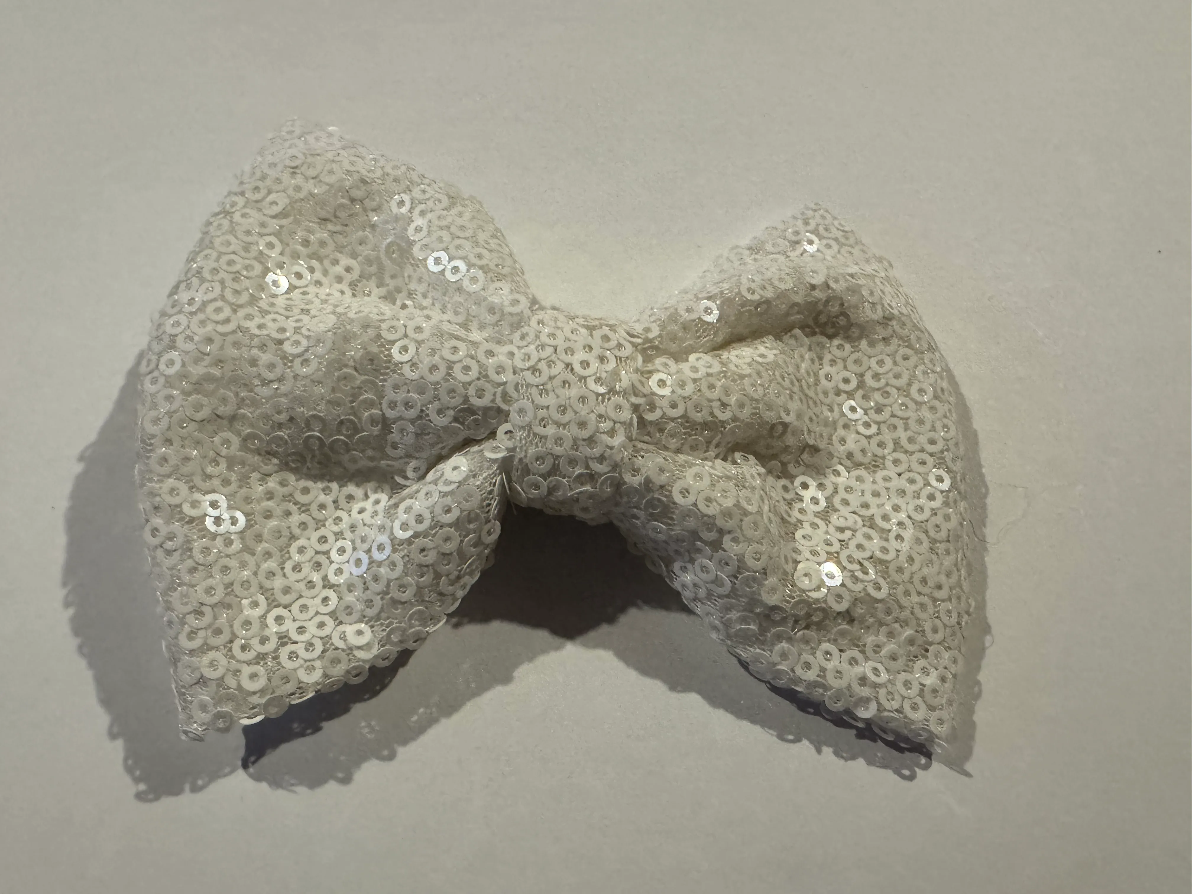 WHITE SEQUIN BOW HAIR CLIP