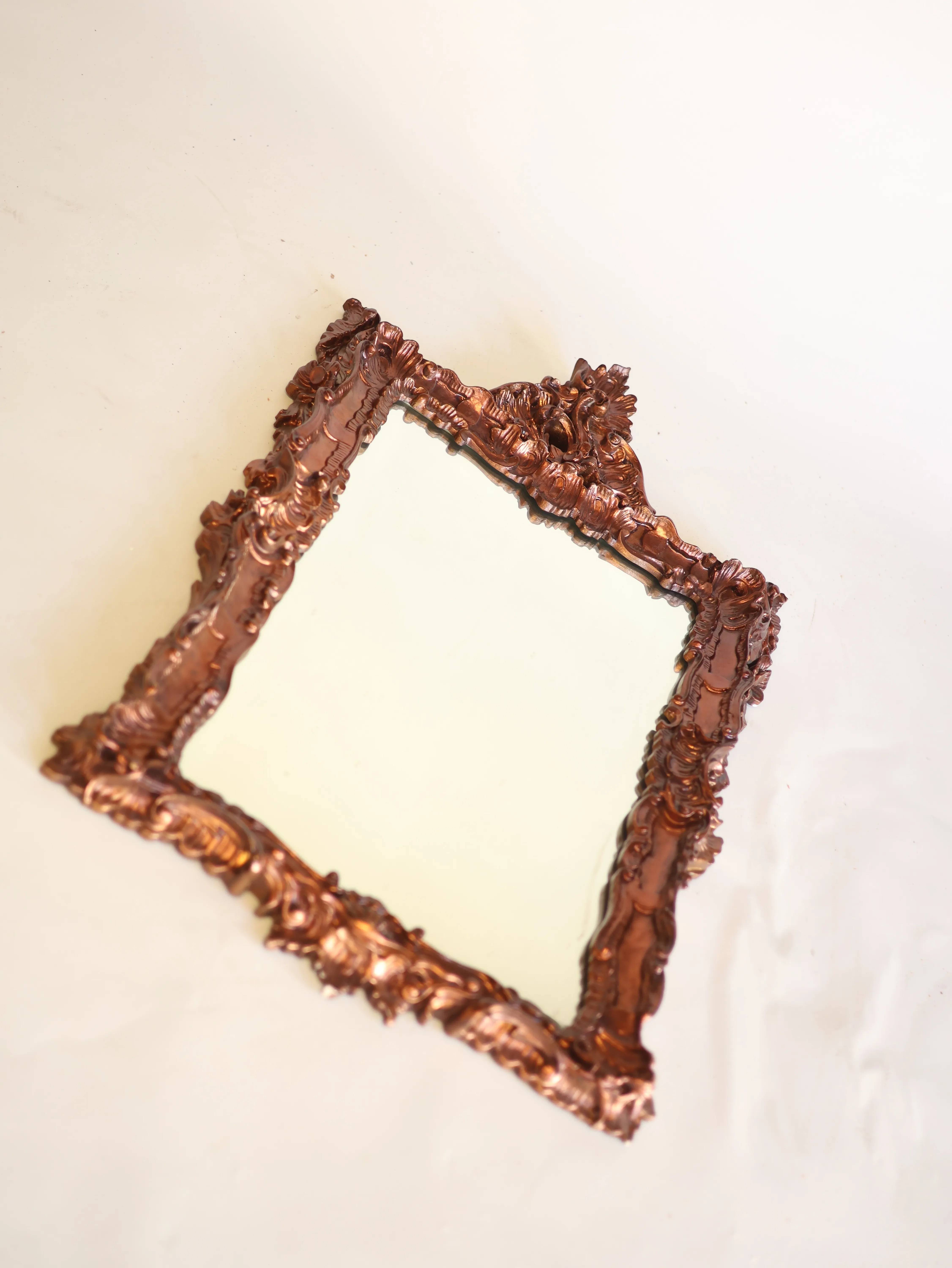 Carved copper mirror