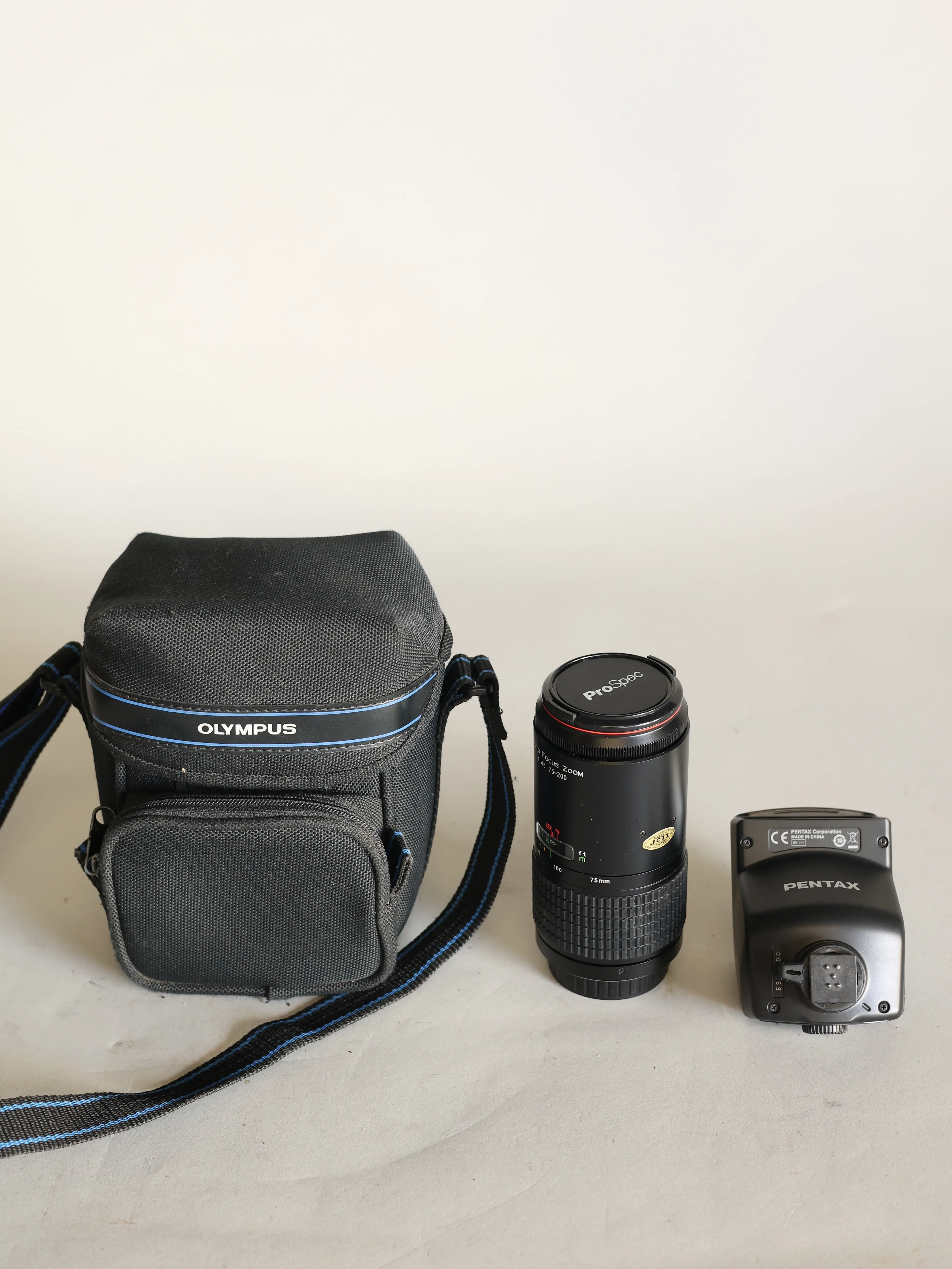 Camera lens and flash in olympus case