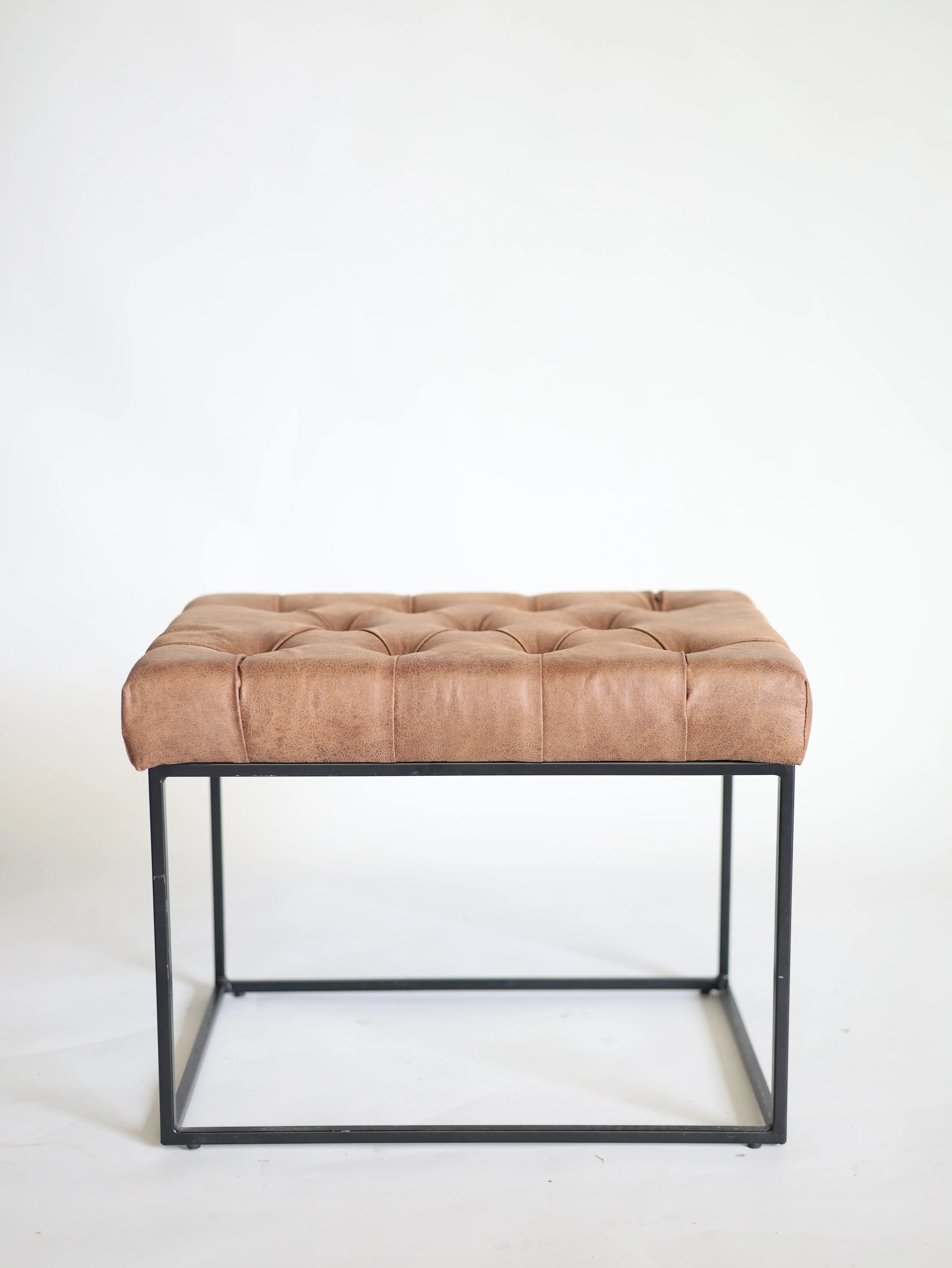 Leather and iron ottoman