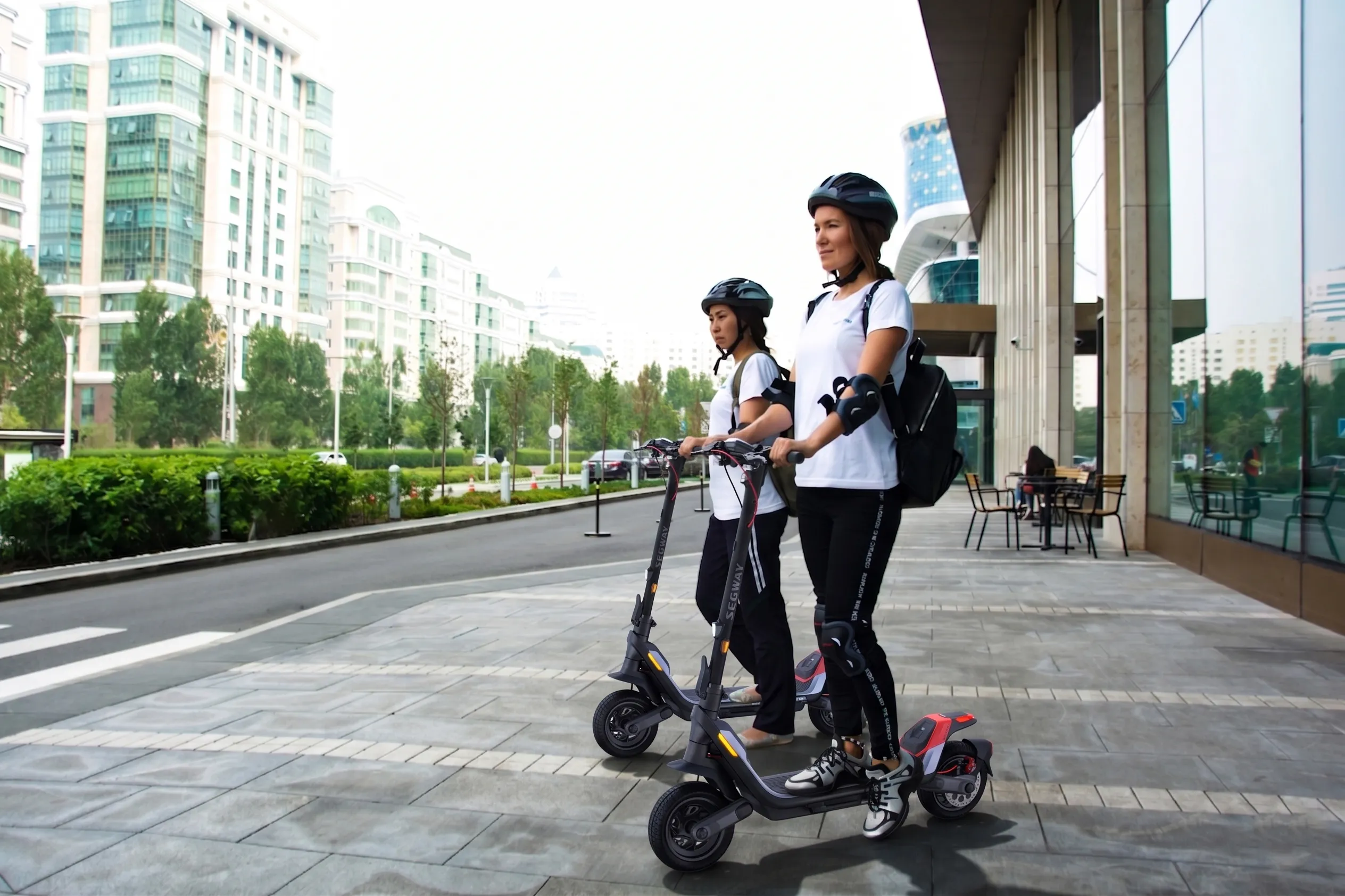Two people riding Segway P100 Scooters offered through MyPEV Rentals in Jacksonville, FL