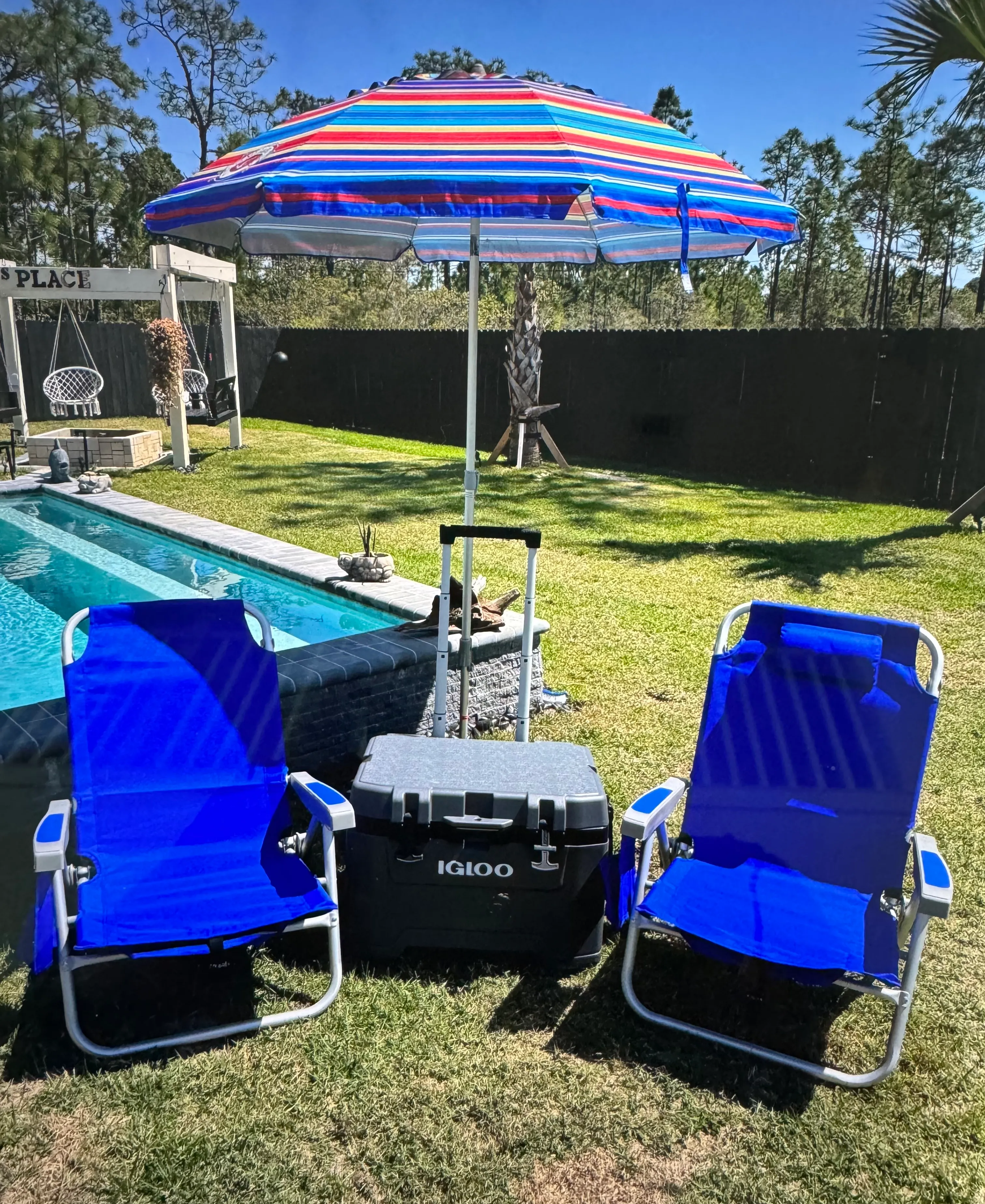2 chairs, umbrella and large cooler