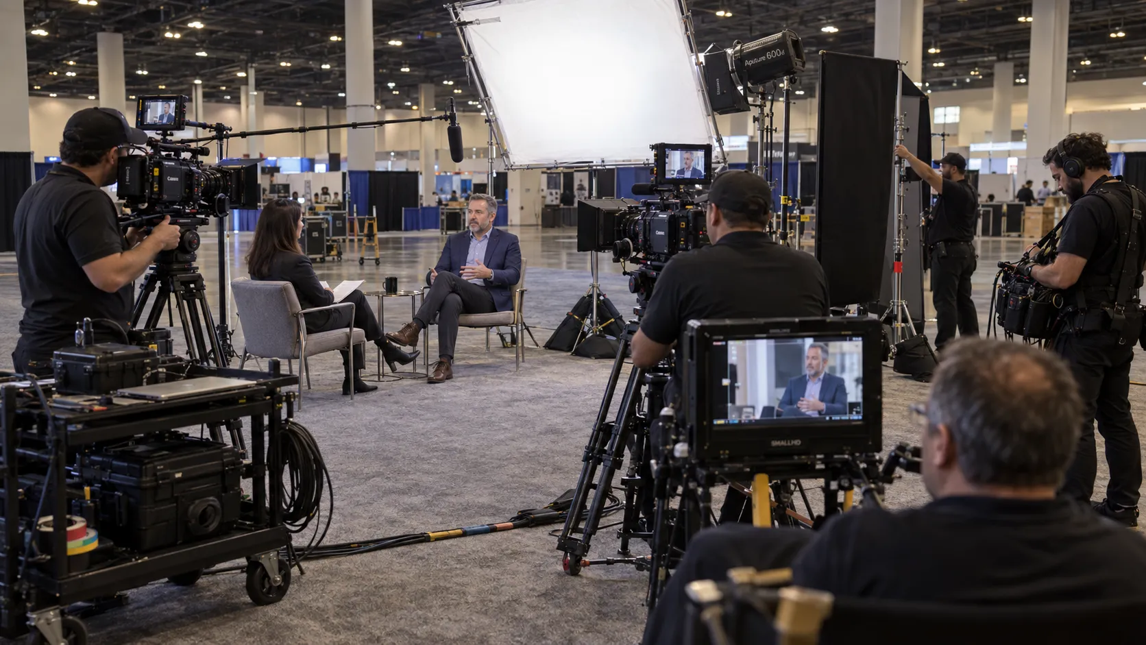 Professional interview set with cinema cameras, LED lighting, diffusion frames, flags, stands and grip equipment in Las Vegas