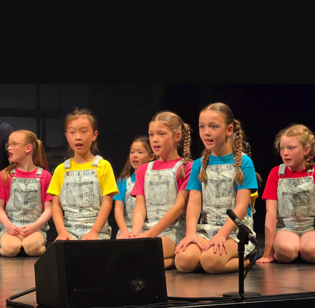 Joseph - School children coloured t-shirts and denim shorts 