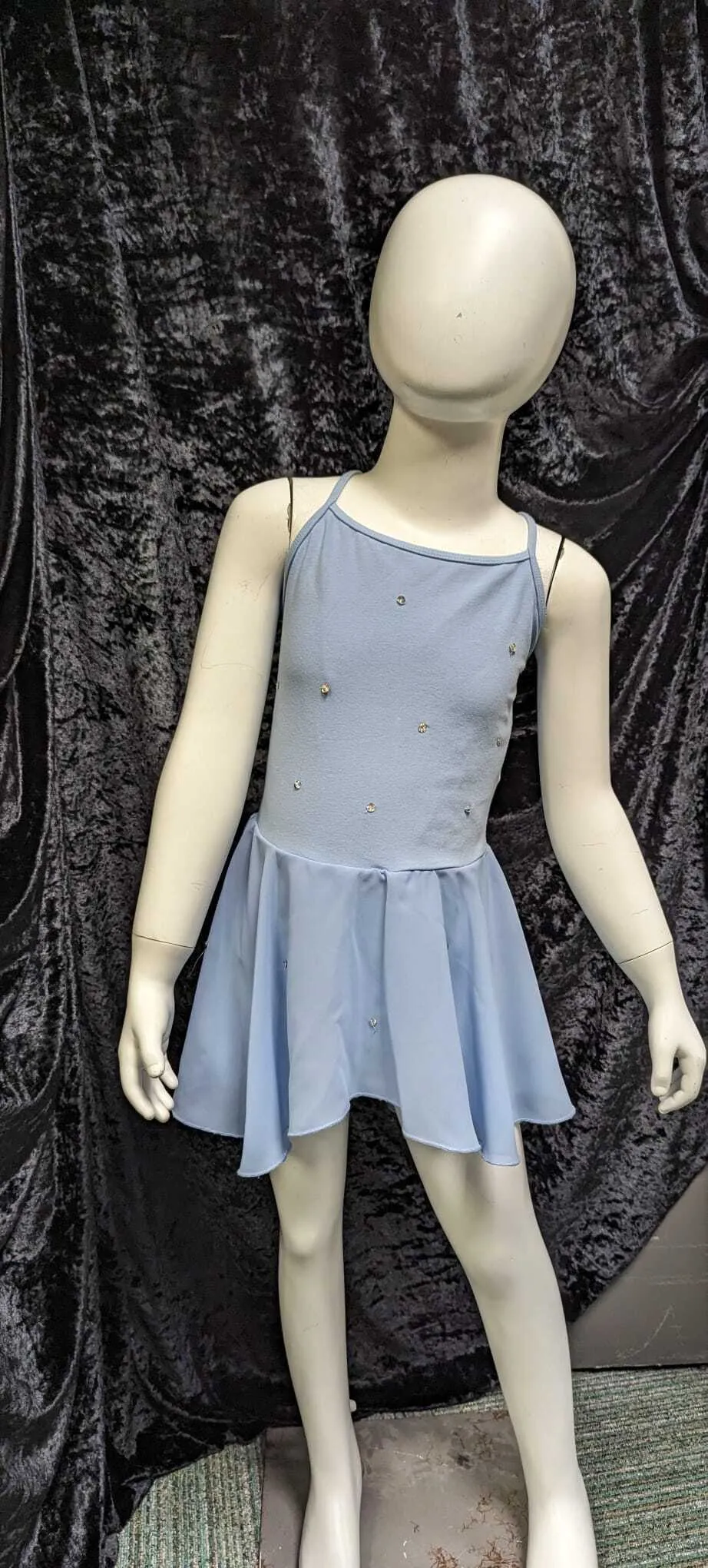 Blue leotard with attached chiffon skirt and sequins