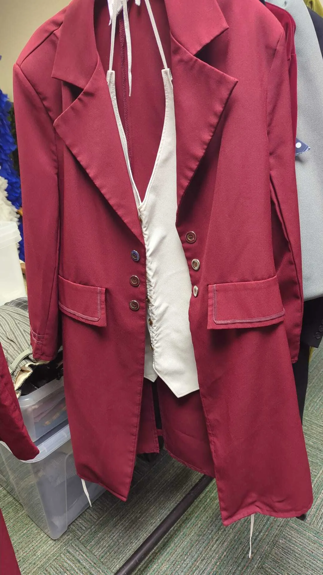 Red tailcoat with cream waistcoat (ties at the back)