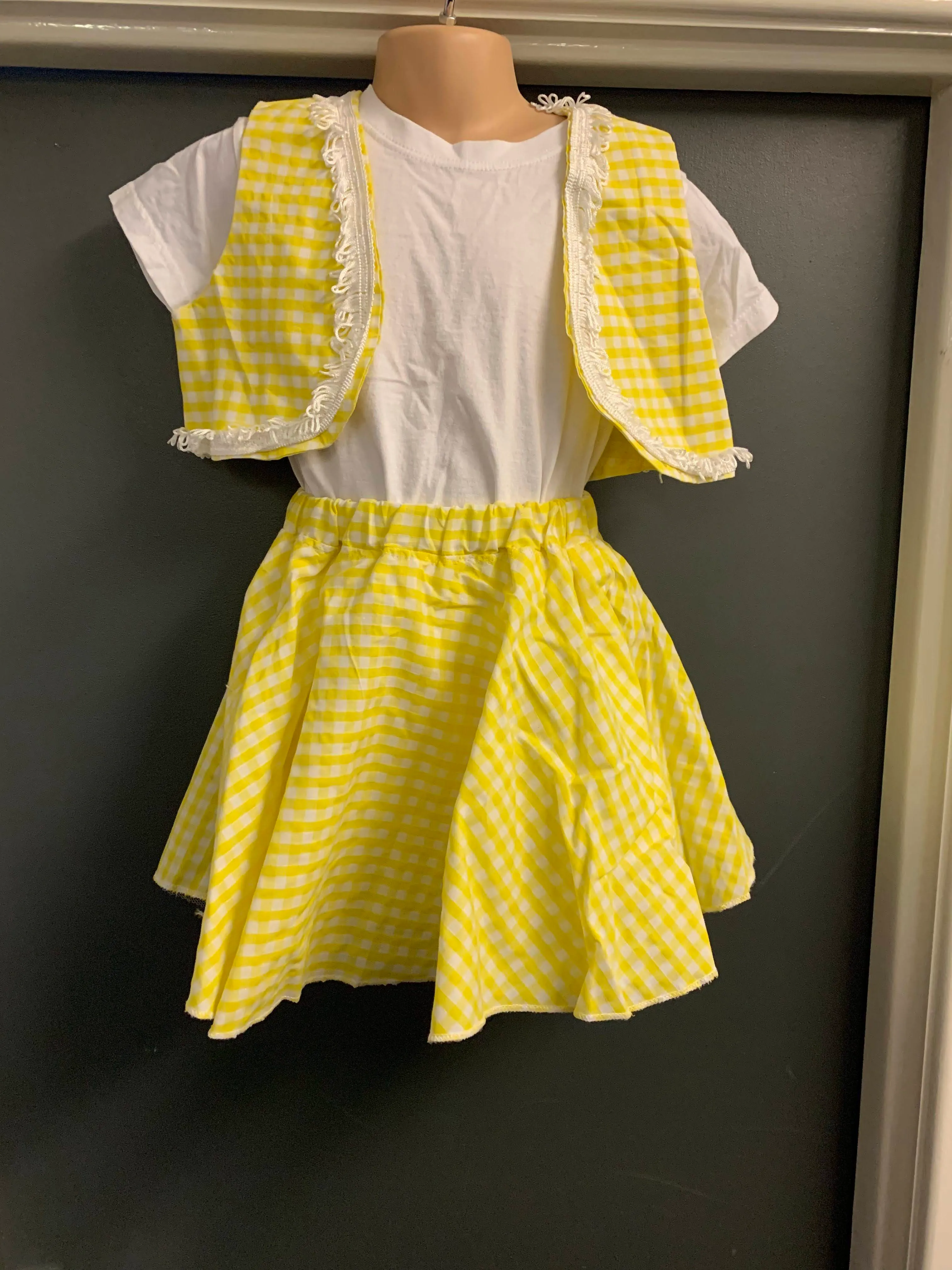 Yellow and white checked skirt with matching waistcoats with white trim