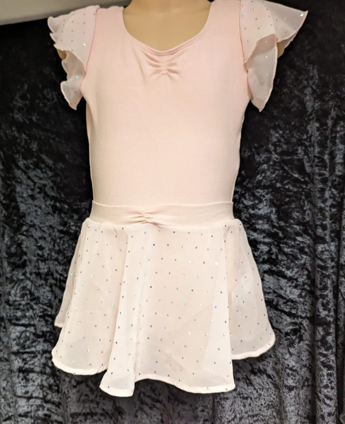 Pink leotard with diamantés and chiffon capped sleeves with a removable chiffon skirt and diamanté detail 