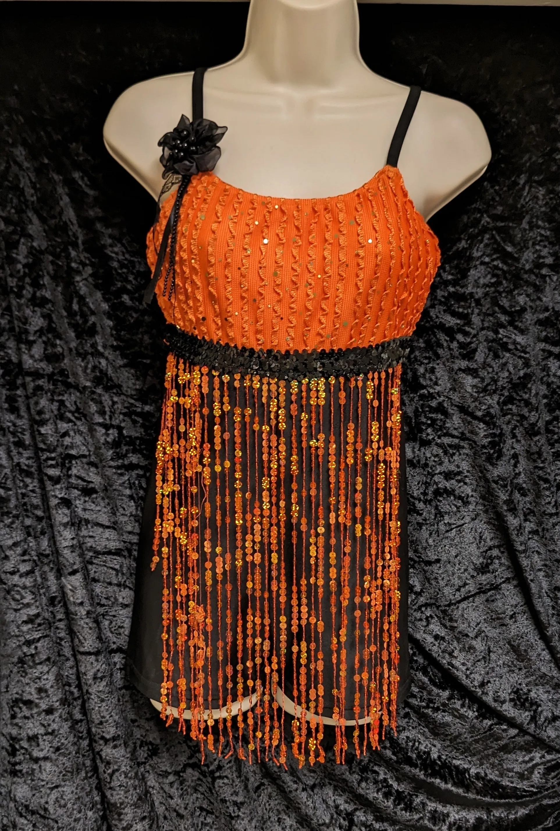 Orange play suit with unitard shorts and sequin tassels