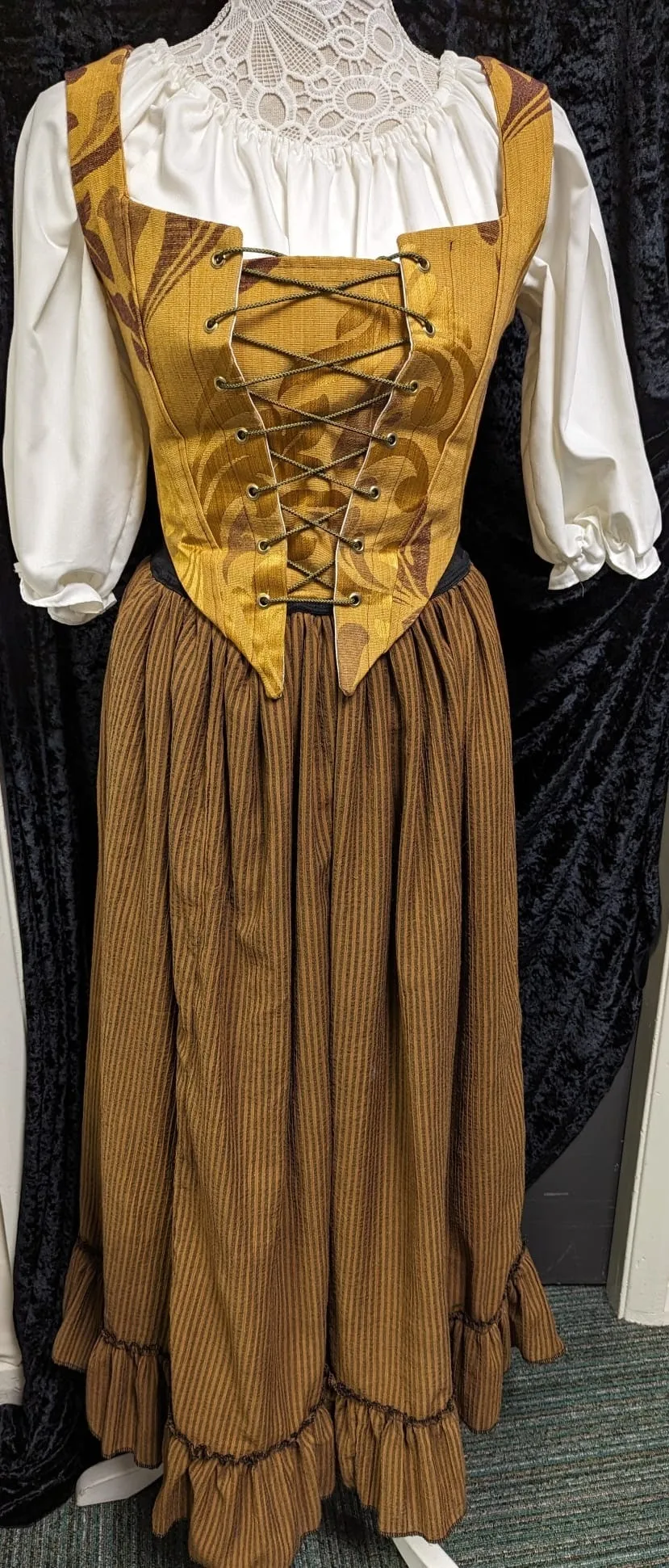 Bet costume from Oliver with adjustable basque to fit more sizes.  Brown and gold victorian style dress