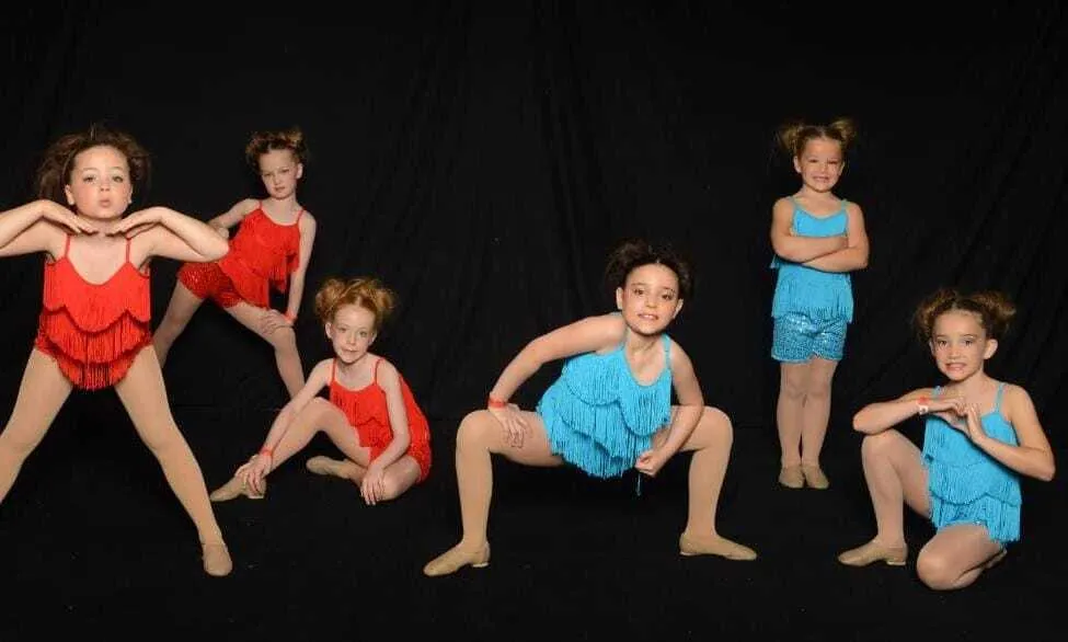 Red or blue sequin shorts with matching red or blue tassel top