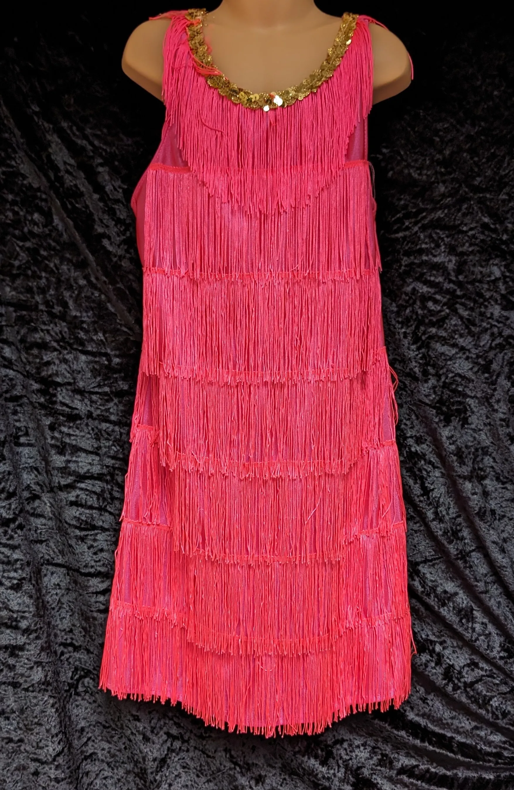 Pink child's flapper style dress with tassels