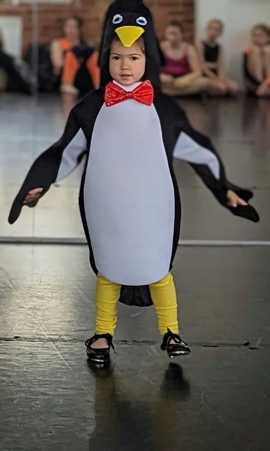 Penguin costume with yellow leggings