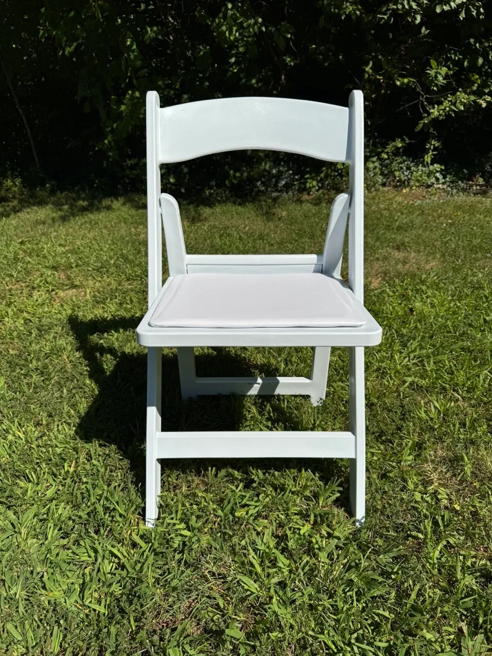 White padded resin chair