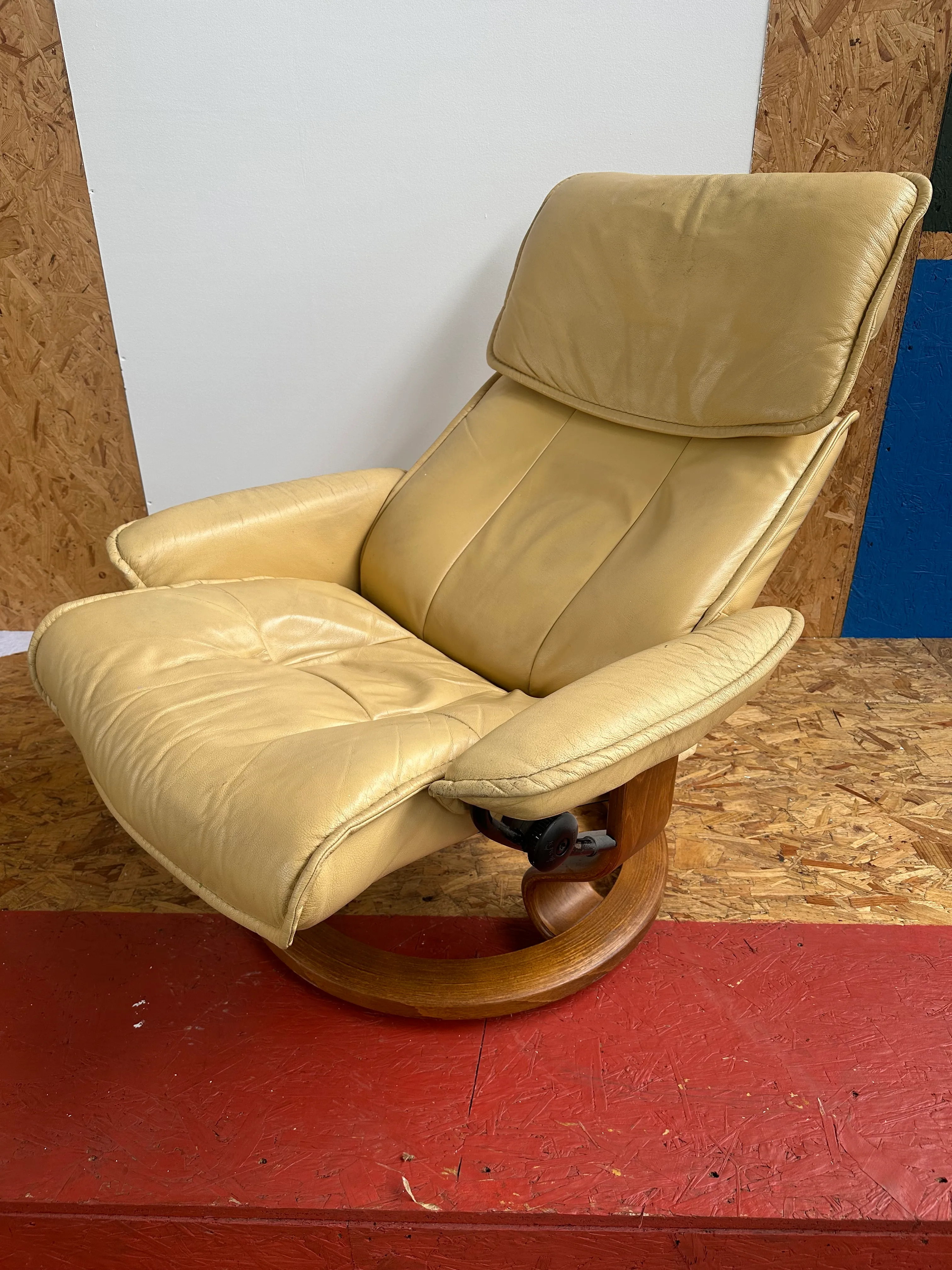 Distressed Beige Leather Reclining Swivel Armchair