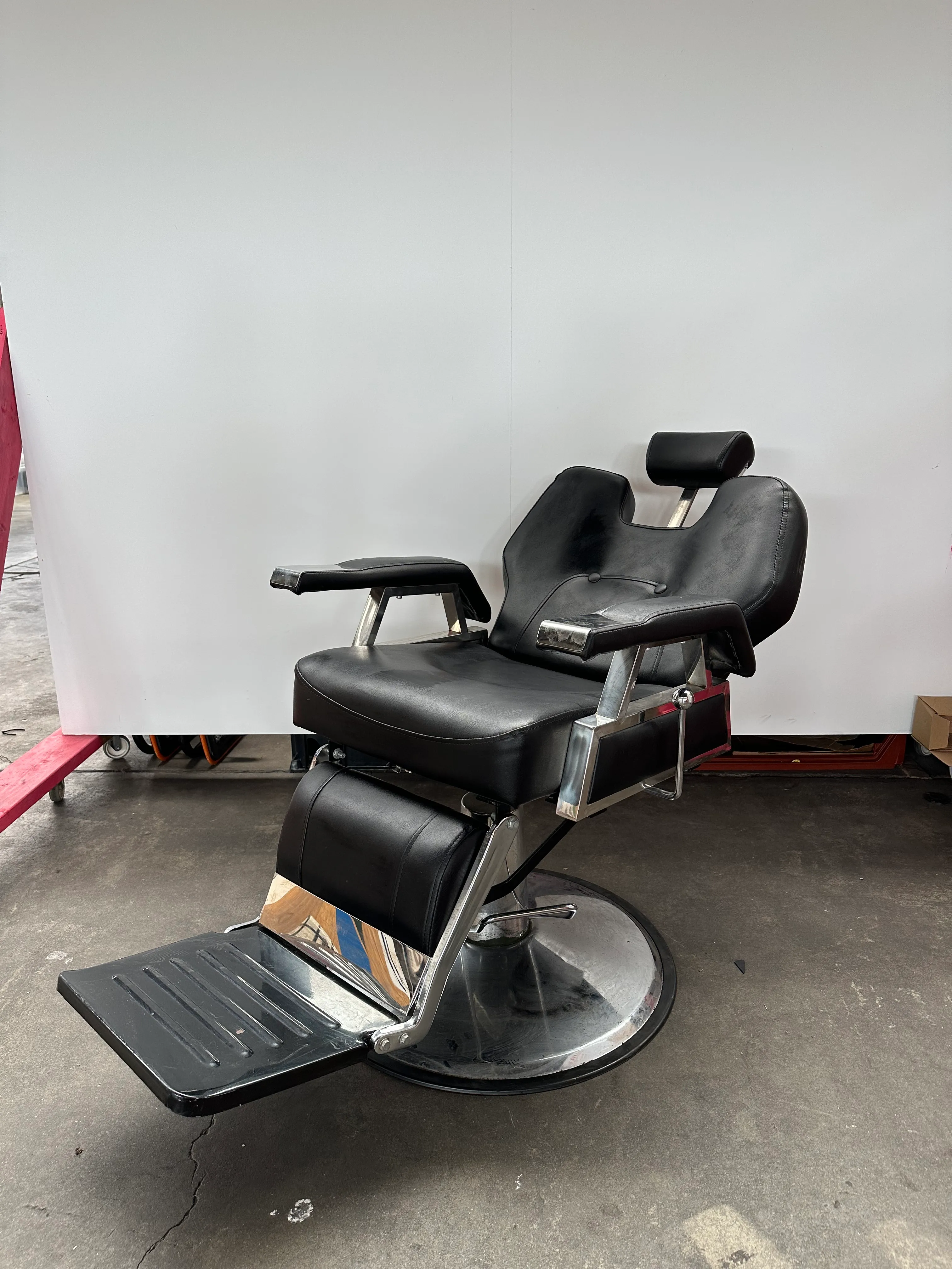 Black Leather Barber's Chair with Reclining Headrest