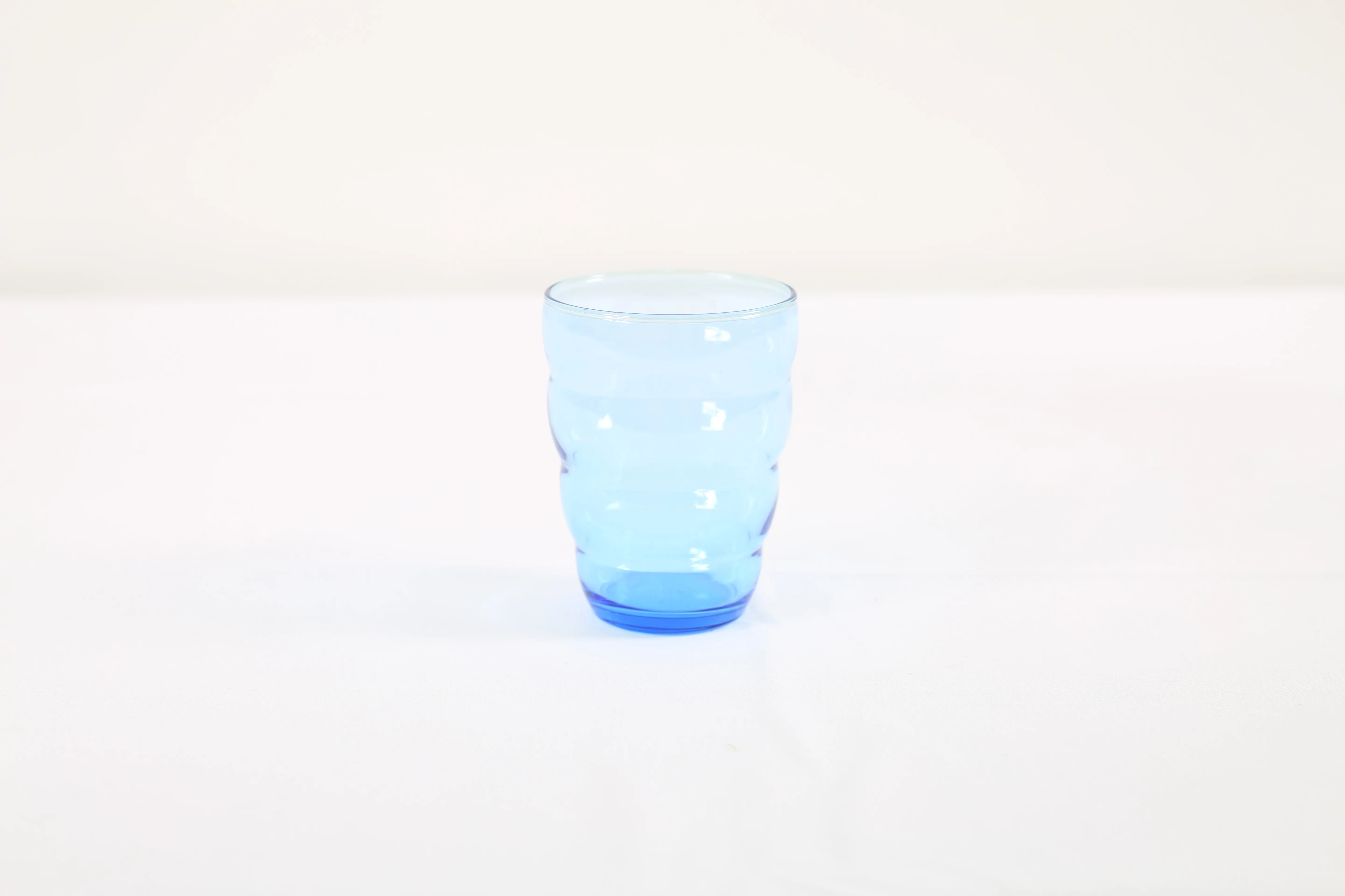 Transparent blue water glass