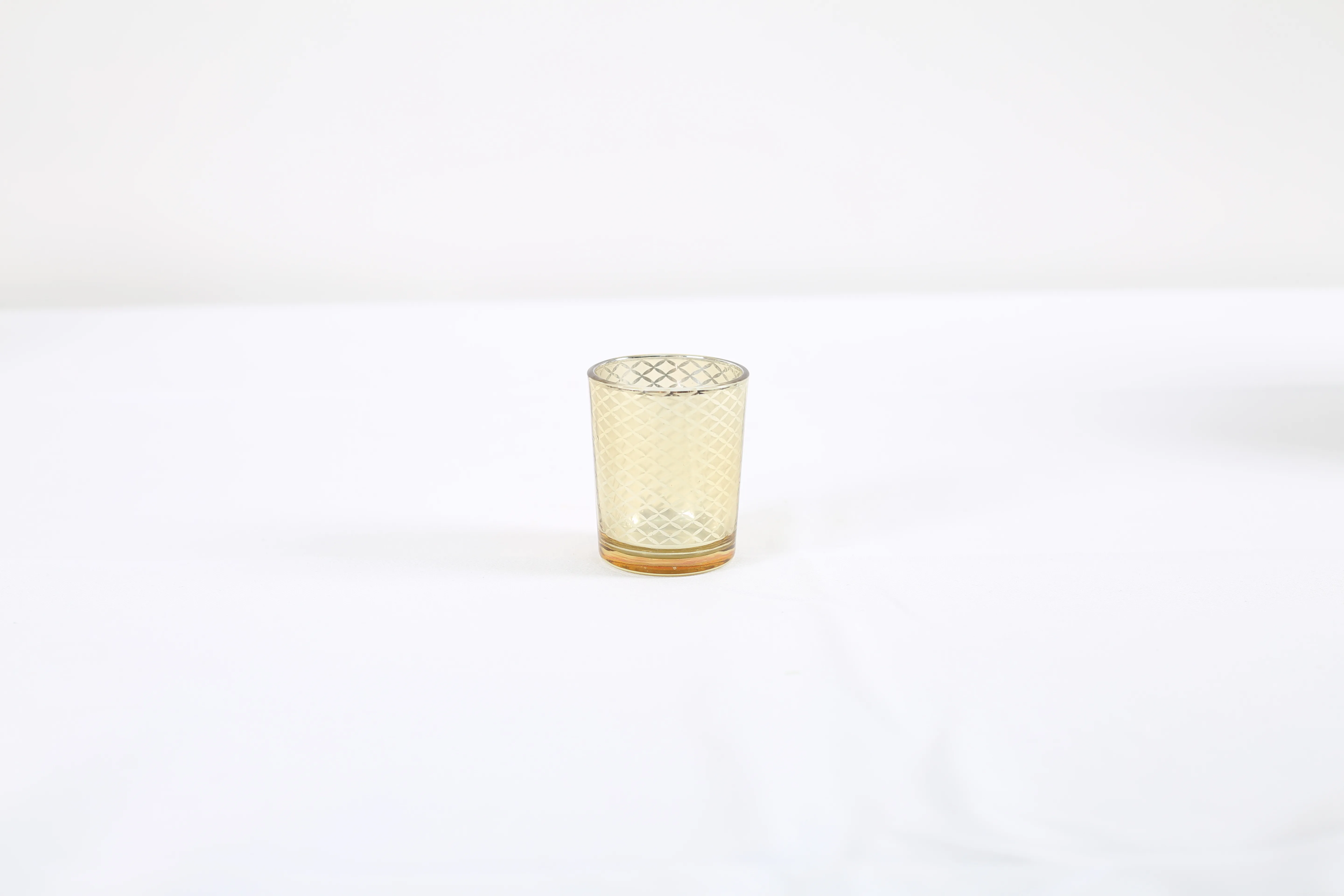 Candle jar with gold check pattern and lights
