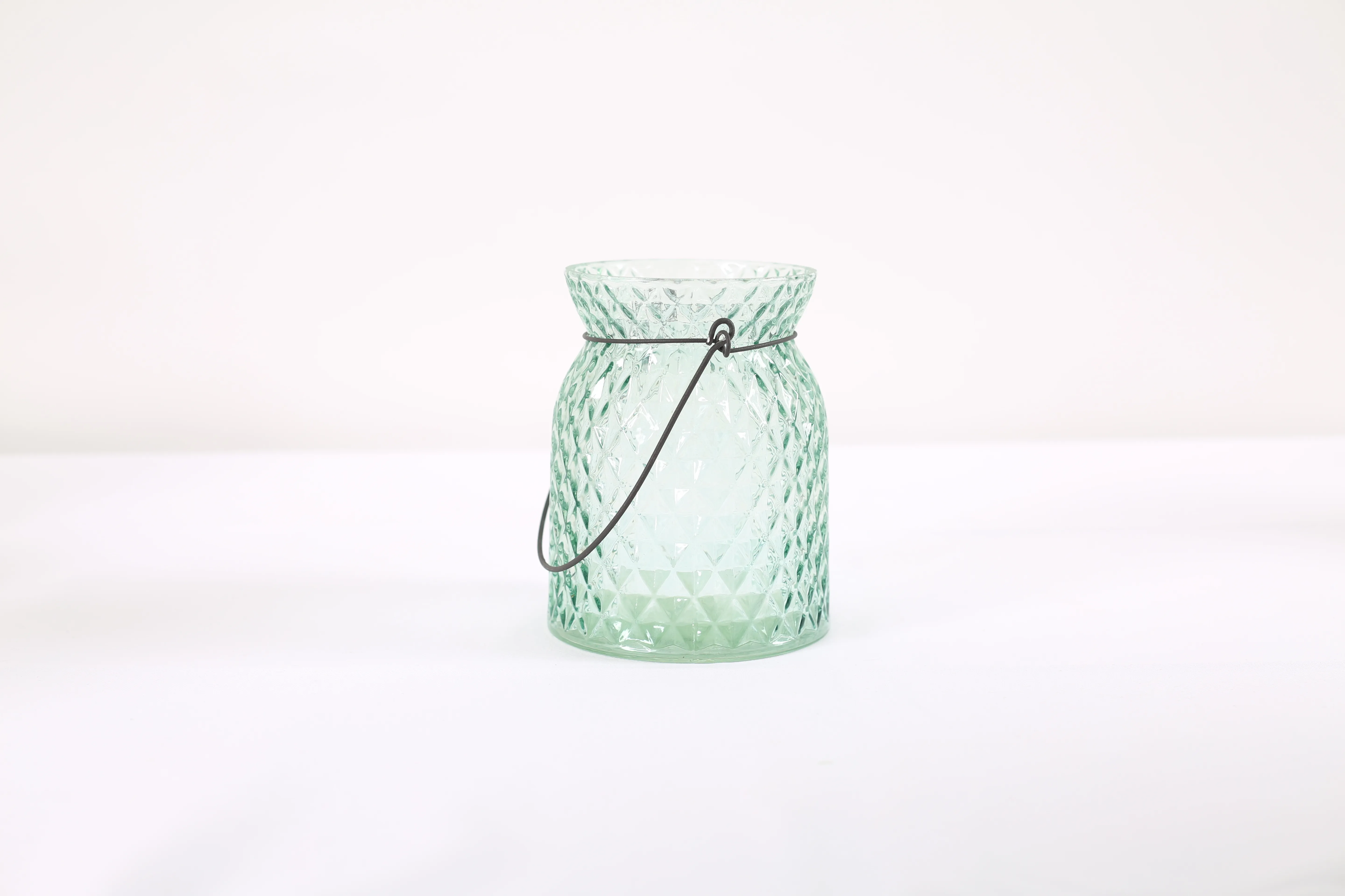 Blue glass candle jar with lights