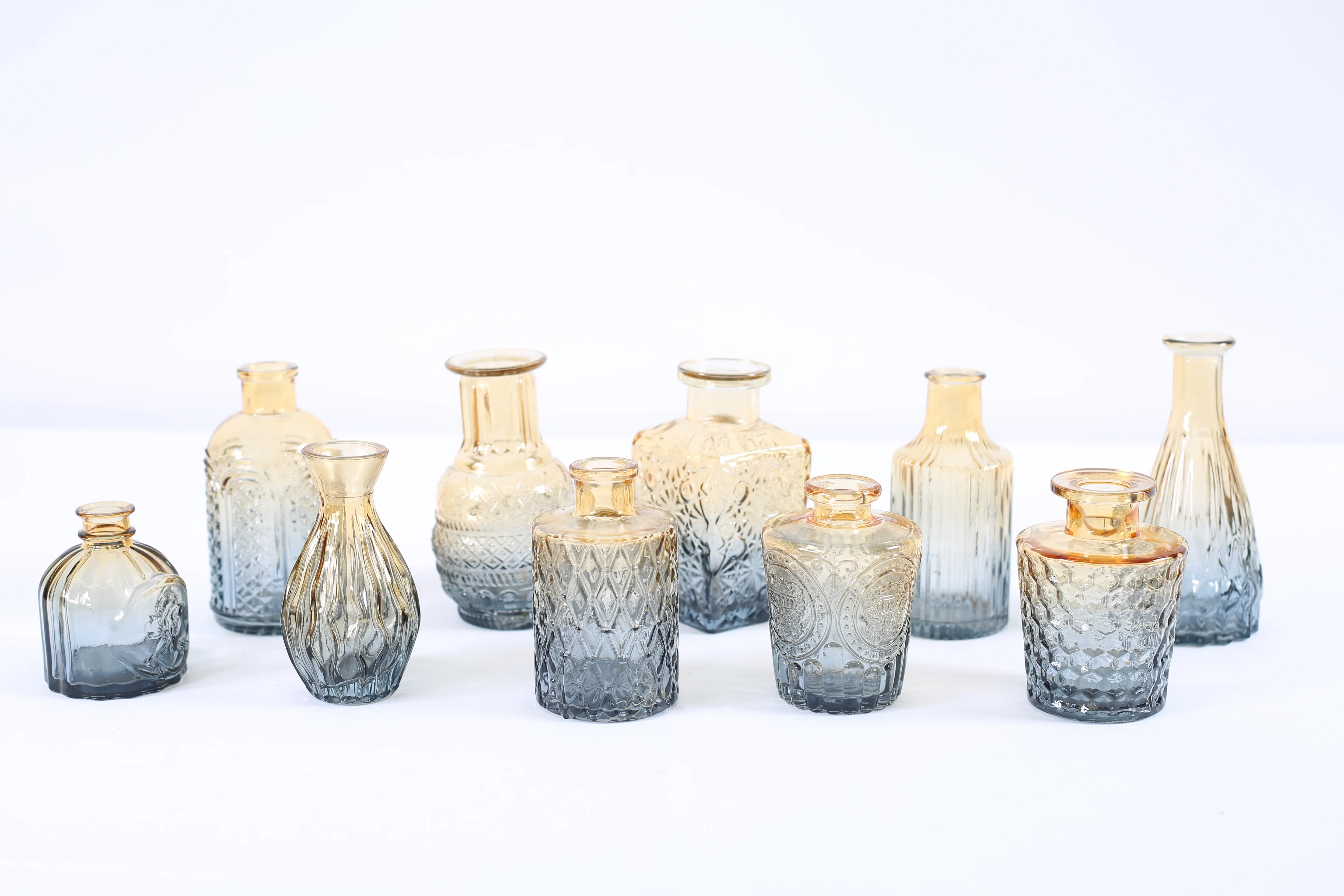 Assortment of black and gold decanters