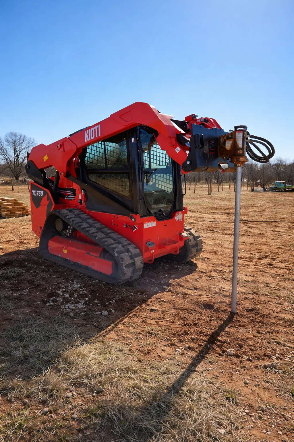 Kioti 75 HP skid steer/bobcat with post driver