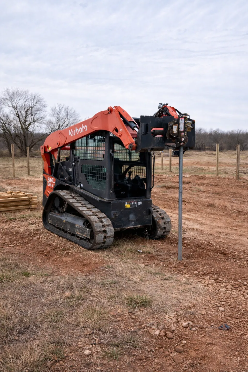 Kubota 65 HP skid steer/bobcat with post driver